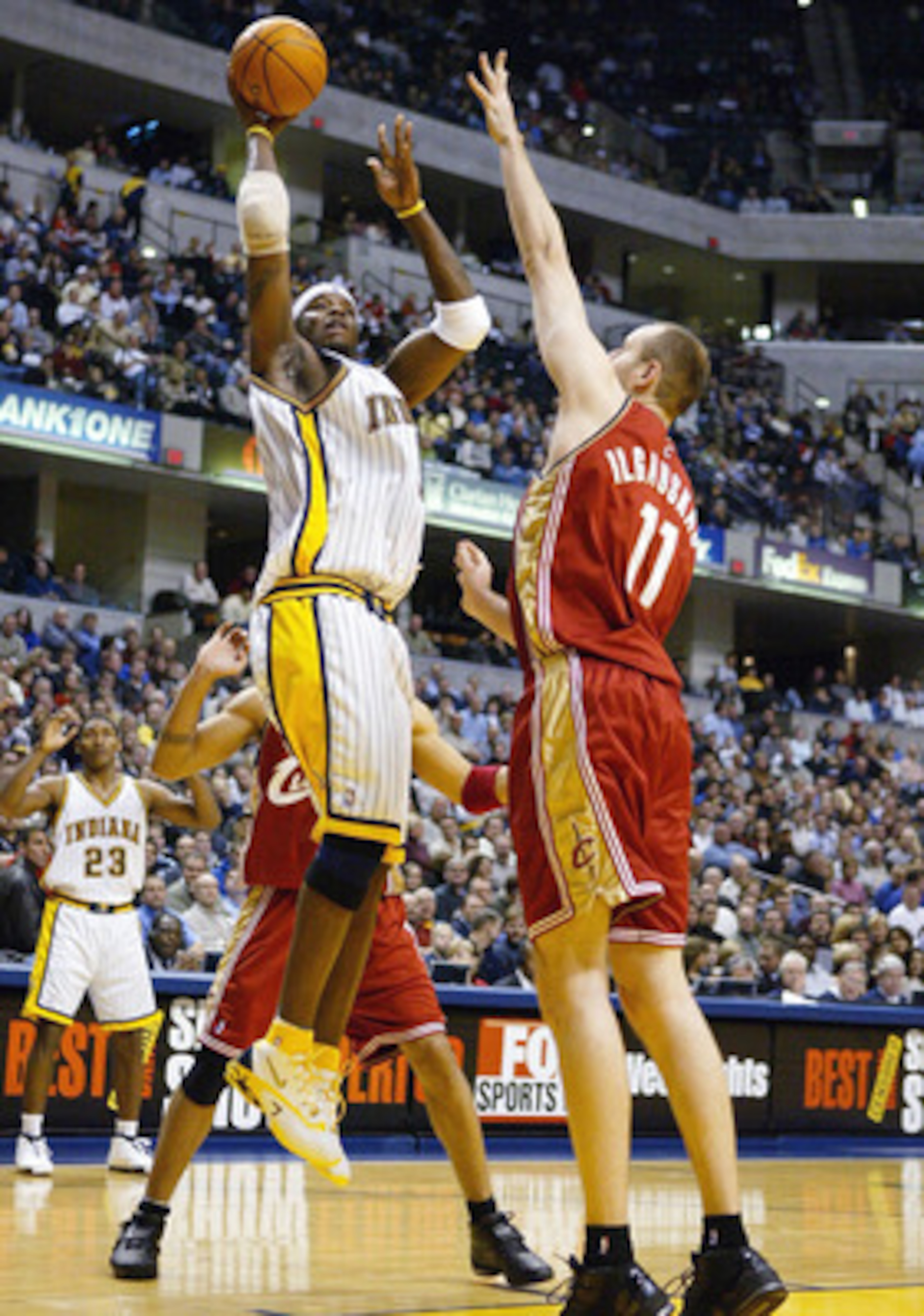 INDIANAPOLIS - DECEMBER 15:  Jermaine O'Neal #7 of the Indiana Pacers shoots the ball while being defended by Zydrunas Ilgauskas #11 of the Cleveland Cavaliers in NBA action December15, 2003 at Conseco Fieldhouse in Indianapolis, Indiana. NOTE TO USER: Us