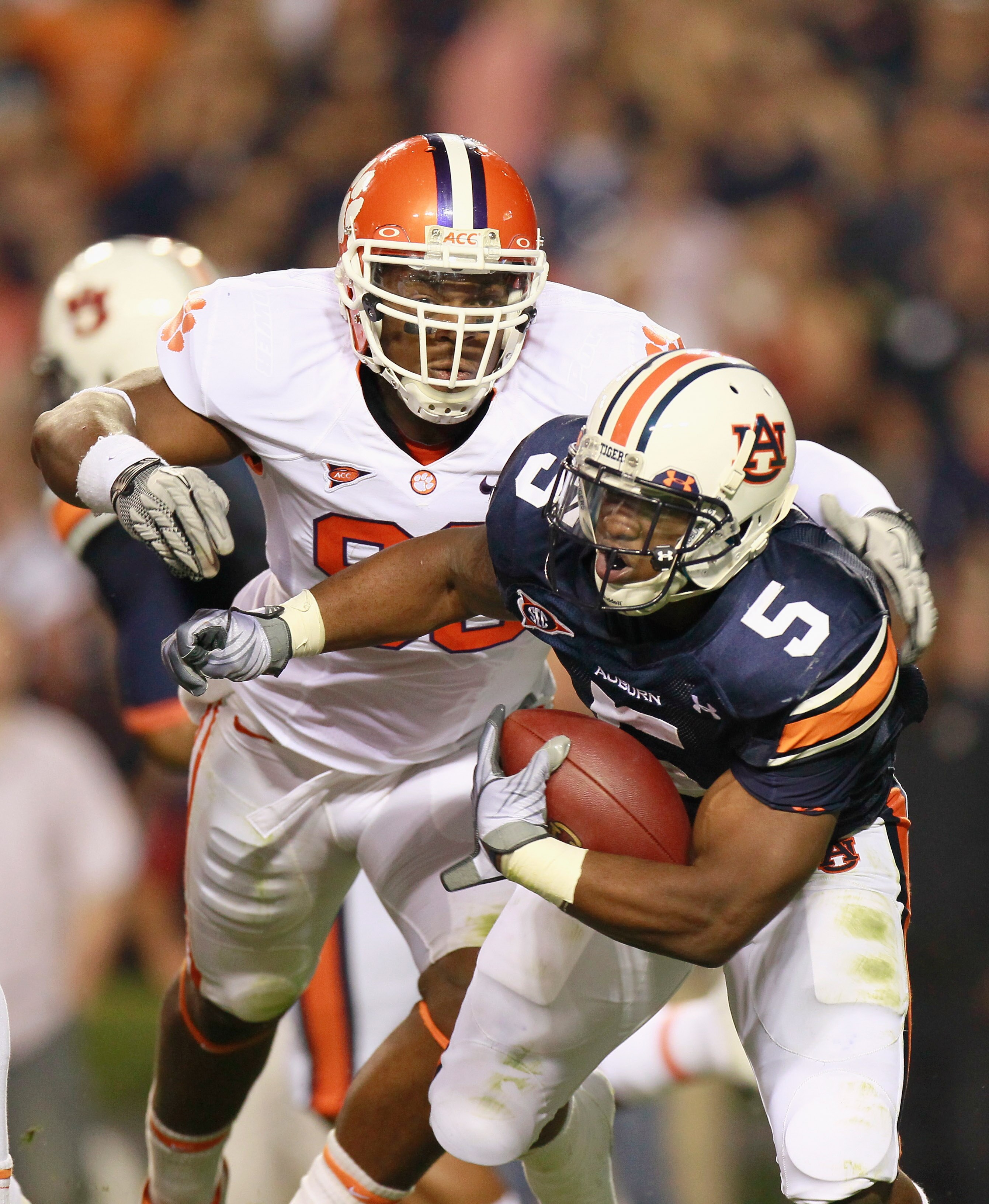 AUBURN, AL - SEPTEMBER 18:  Michael Dyer #5 of the Auburn Tigers against Da'Quan Bowers #93 of the Clemson Tigers at Jordan-Hare Stadium on September 18, 2010 in Auburn, Alabama.  (Photo by Kevin C. Cox/Getty Images)