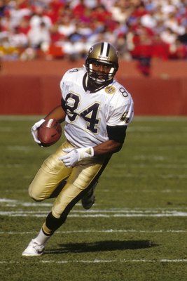 SAN FRANCISCO - DECEMBER 01:  Wide receiver Eric Martin #84 of the New Orleans Saints runs with the ball during the game against the San Francisco 49ers at Candlestick Park on December 1, 1991 in San Francisco, California.  The 49ers won 38-24.  (Photo by