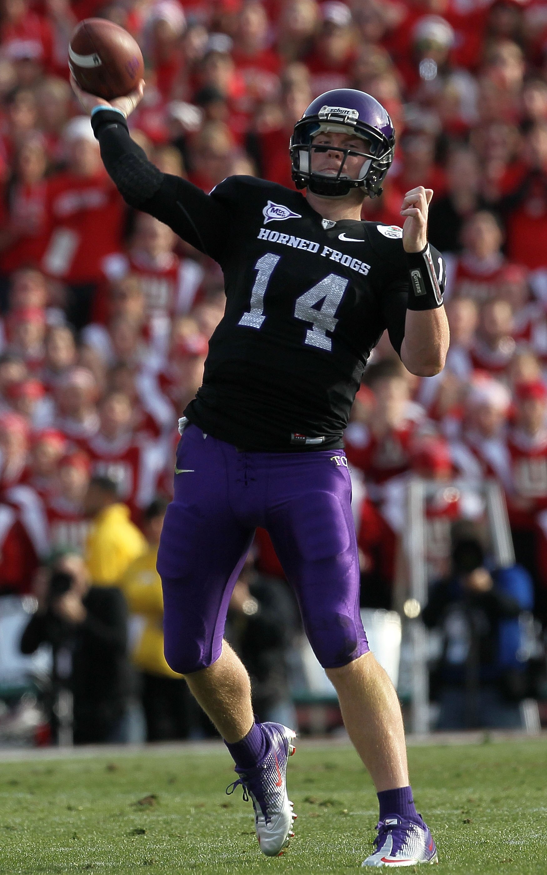 PASADENA, CA - JANUARY 01:  Quarterback Andy Dalton #14 of the TCU Horned Frogs throws a pass against the Wisconsin Badgers in the 97th Rose Bowl game on January 1, 2011 in Pasadena, California.  (Photo by Jeff Gross/Getty Images)