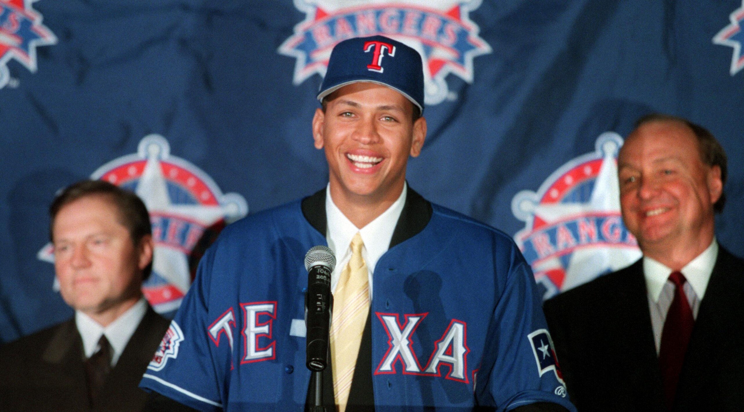 12 Dec 2000: Newly signed Texas Ranger Alex Rodriguez, center, is introduced to the media by club owner Tom Hicks, right, and Rodriguez' agent Scott Boras during a press conference at The Ballpark in Arlington, Texas. Mandatory Credit: Gary Barber/ALLSPO 12 Dec 2000: Newly signed Texas Ranger Alex Rodriguez, center, is introduced to the media by club owner Tom Hicks, right, and Rodriguez' agent Scott Boras during a press conference at The Ballpark in Arlington, Texas. Mandatory Credit: Gary Barber/ALLSPO
