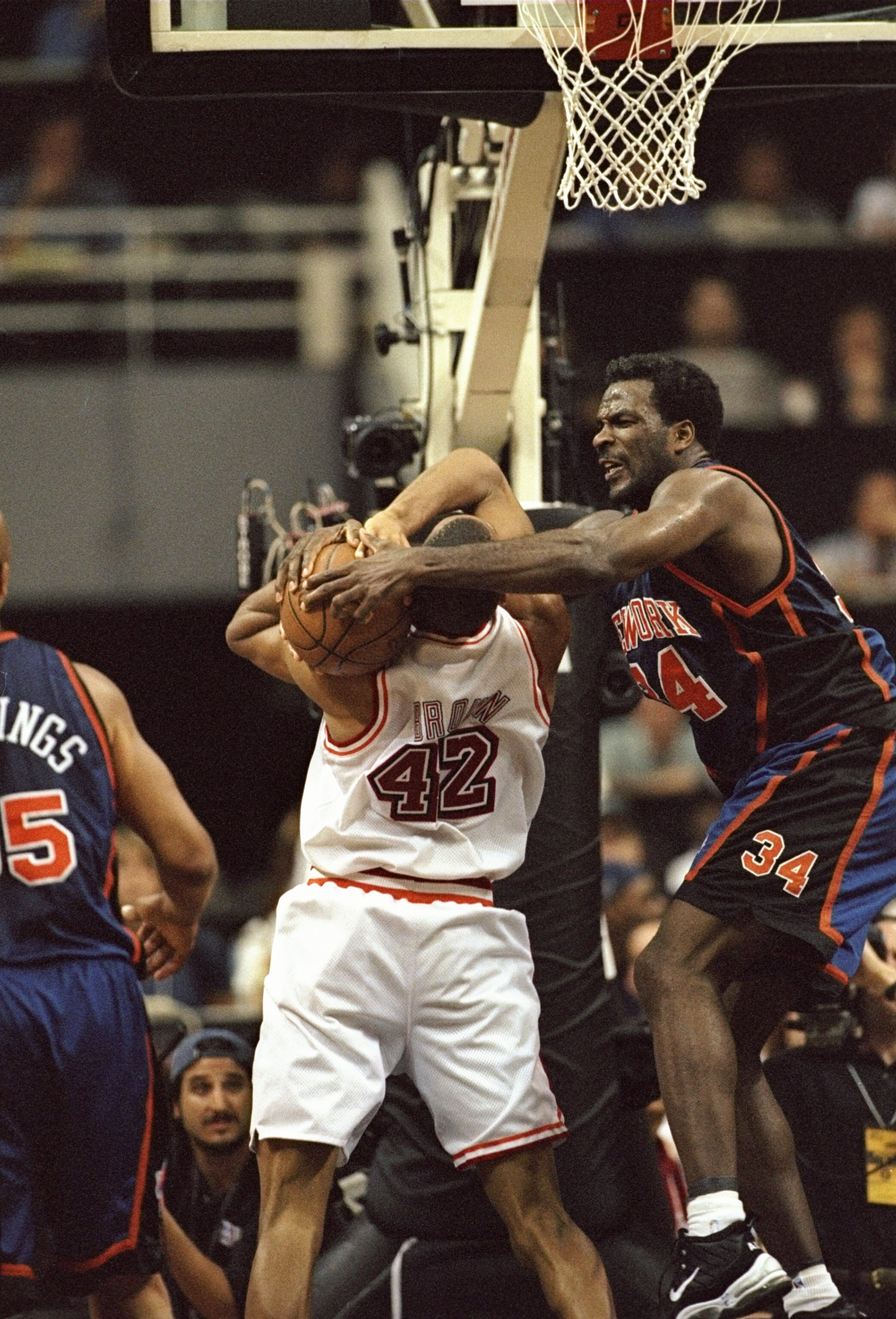 3 May 1998: Charles Oakley #34 of the New York Knicks in action against B.J. Brown #42 of the Miami Heat during a game at the Miami Arena in Miami, Florida. The Knicks defeated the Heat 98-81.