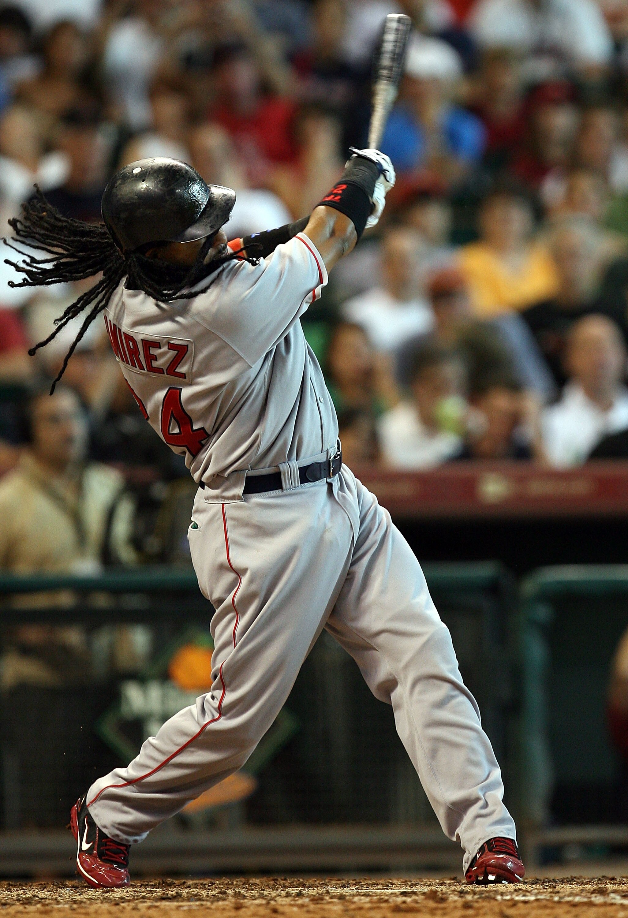 HOUSTON - JUNE 29:  Manny Ramirez #24 of the Boston Red Sox hits a solo home run against the Houston Astros in the seventh inning during an interleague MLB game at Minute Maid Park June 29, 2008 in Houston, Texas.  (Photo by Ronald Martinez/Getty Images)