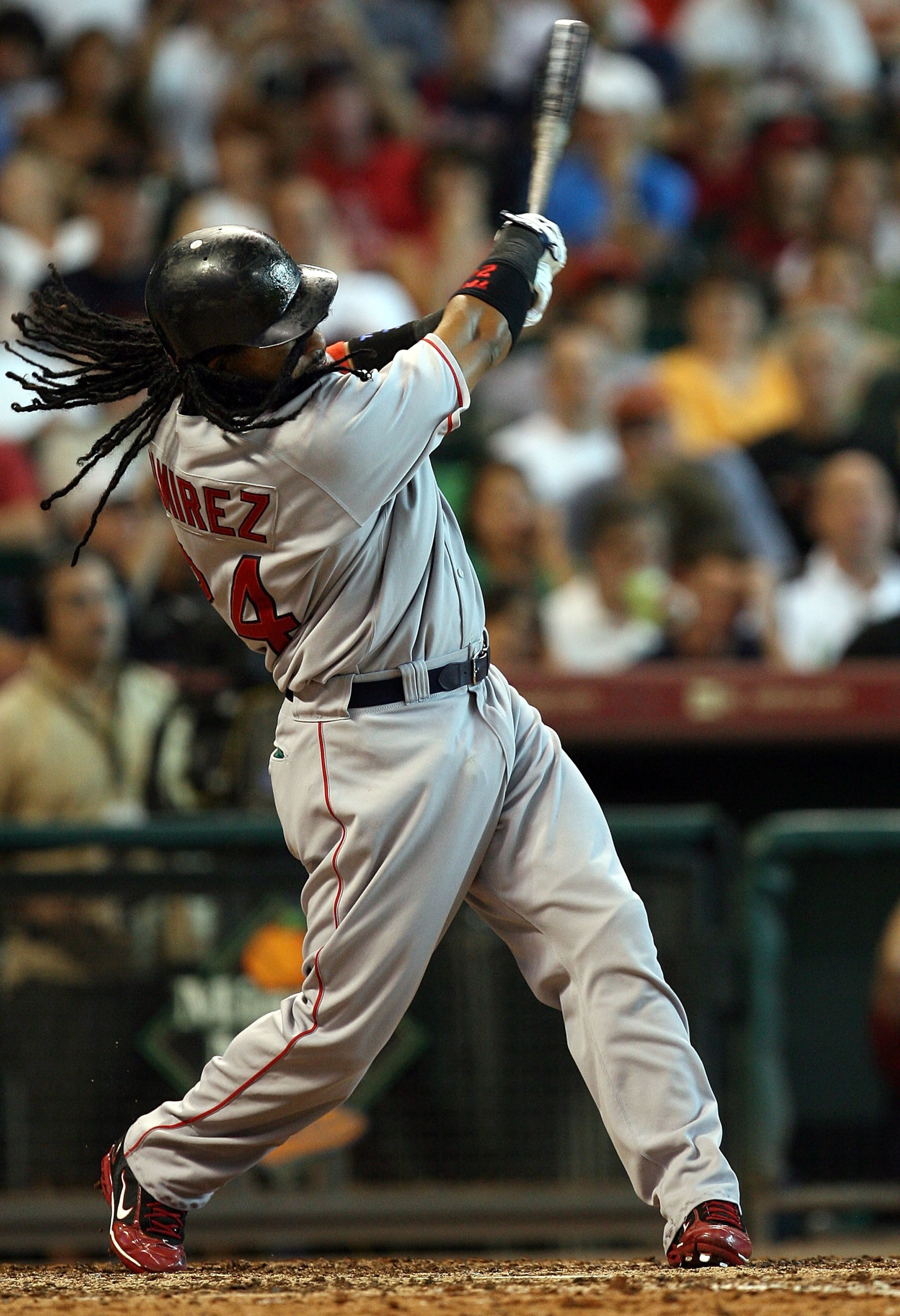 HOUSTON - JUNE 29: Manny Ramirez #24 of the Boston Red Sox hits a solo home run against the Houston Astros in the seventh inning during an interleague MLB game at Minute Maid Park June 29, 2008 in Houston, Texas. (Photo by Ronald Martinez/Getty Images) HOUSTON - JUNE 29: Manny Ramirez #24 of the Boston Red Sox hits a solo home run against the Houston Astros in the seventh inning during an interleague MLB game at Minute Maid Park June 29, 2008 in Houston, Texas. (Photo by Ronald Martinez/Getty Images)