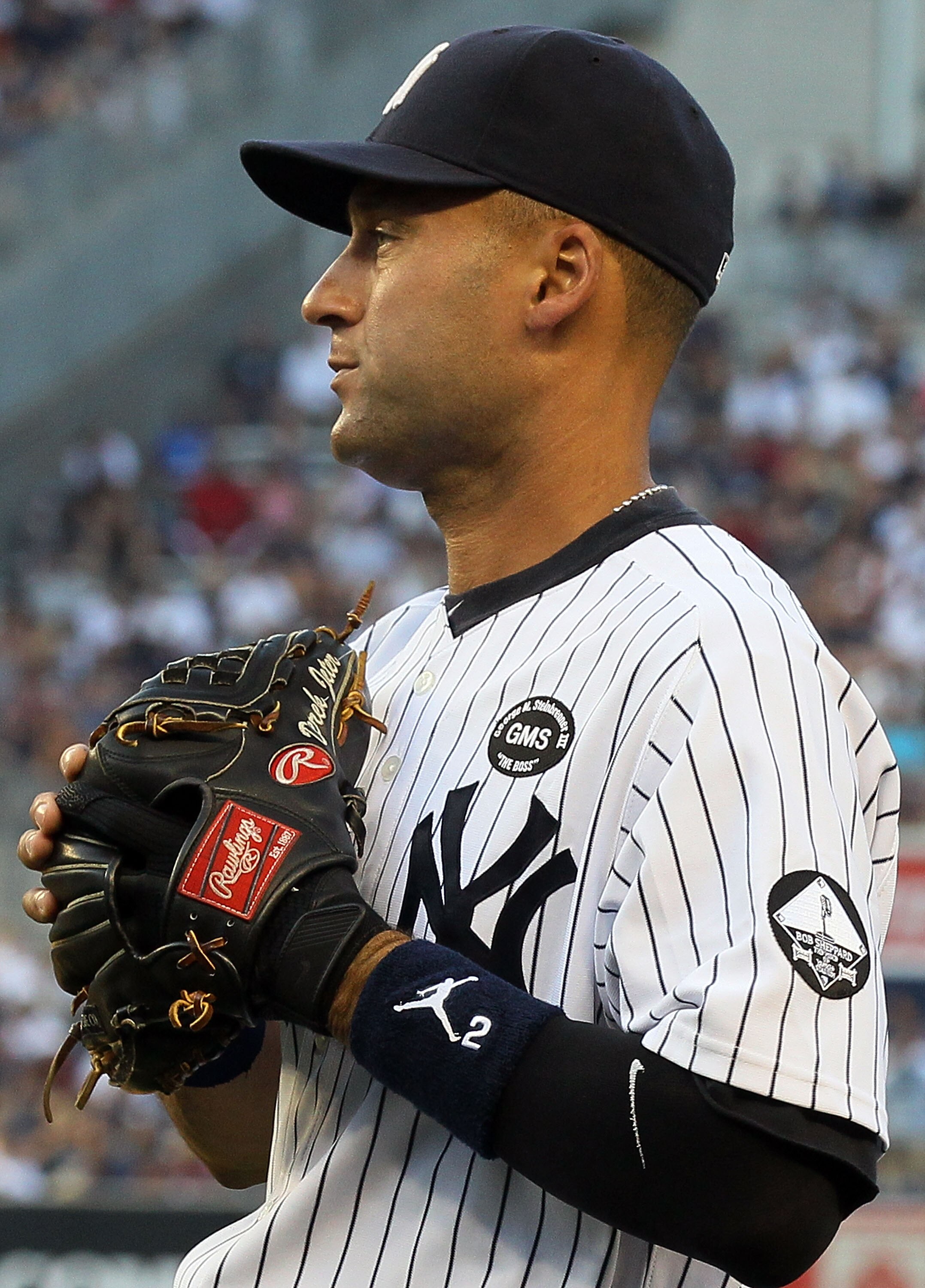 NEW YORK - JULY 16:  A patch honoring the late owner George Steinbrenner of the New York Yankees and Yankee Stadium public address announcer Bob Sheppard is seen on Derek Jeter's #2 uniform prior to the game against the Tampa Bay Rays on July 16, 2010 at