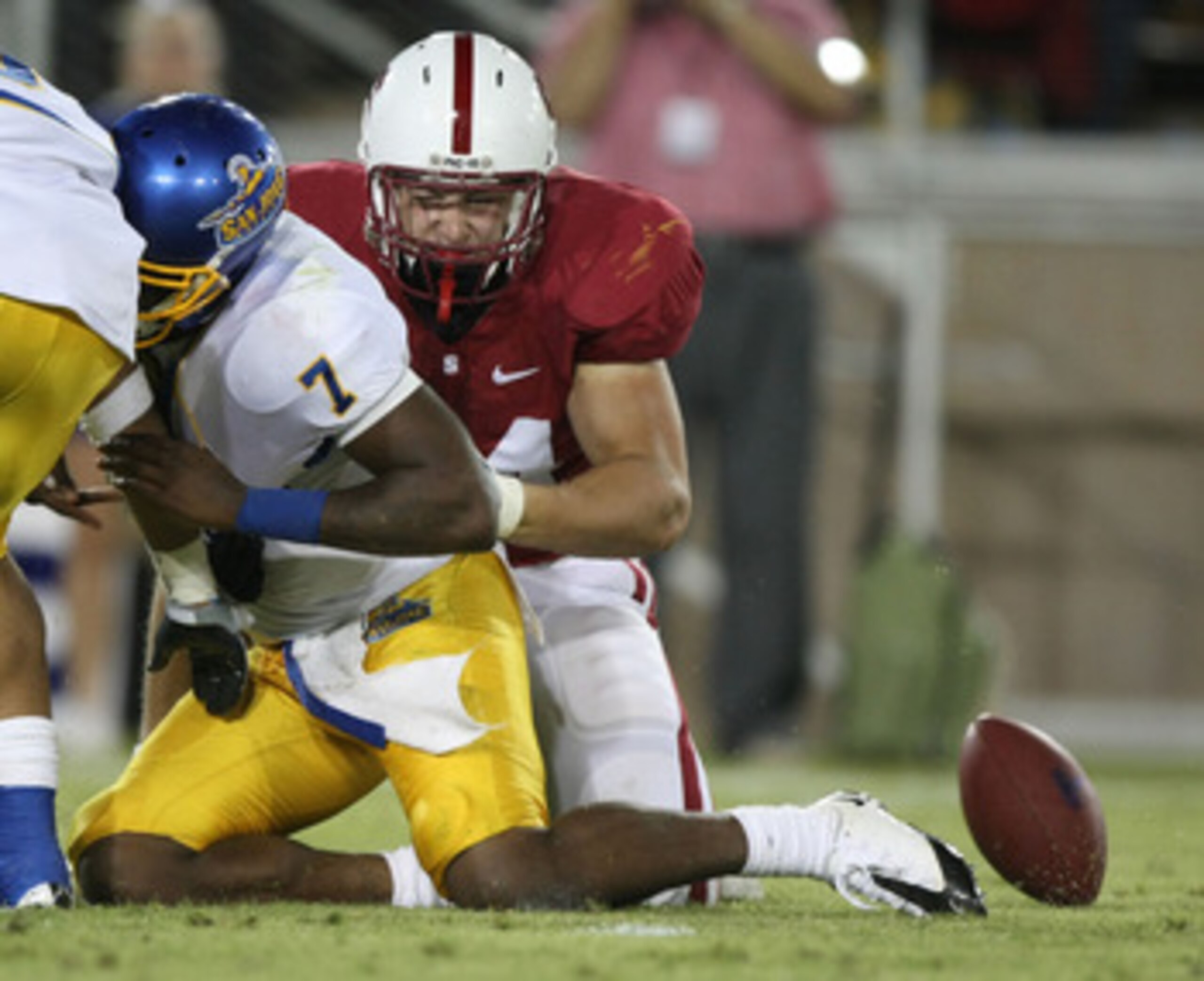STANFORD, CA - SEPTEMBER 20: Kyle Reed #7 of San Jose State Spartans fumbles the ball as Tom Keiser #94 of the Stanford Cardinals defends during the fourth quarter at Stanford Stadium on September 20, 2008 in Stanford, California. (Photo by Jed Jacobsoh STANFORD, CA - SEPTEMBER 20: Kyle Reed #7 of San Jose State Spartans fumbles the ball as Tom Keiser #94 of the Stanford Cardinals defends during the fourth quarter at Stanford Stadium on September 20, 2008 in Stanford, California. (Photo by Jed Jacobsoh