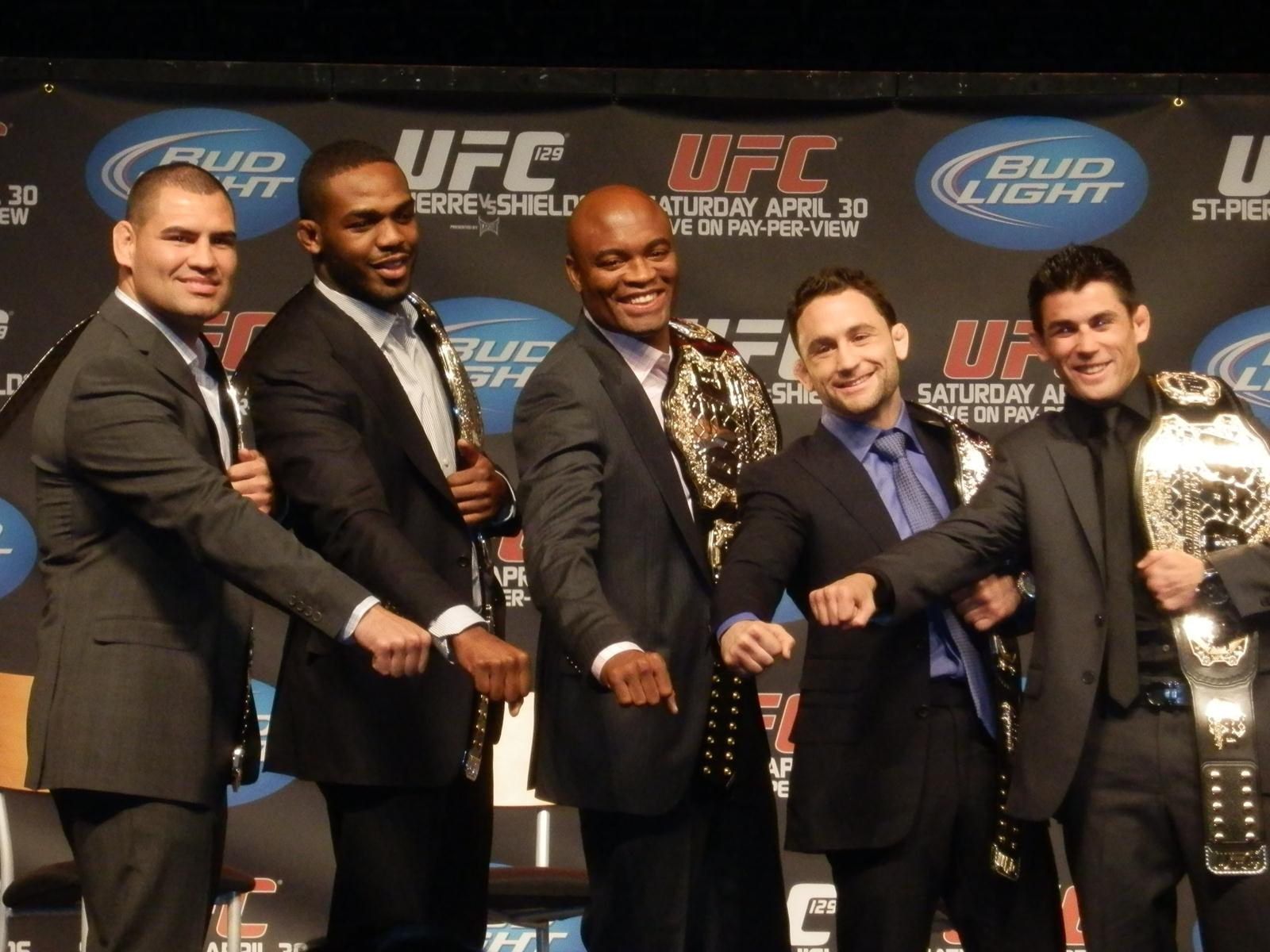 Dominick Cruz flashes his belt. Photo by Leon Horne.