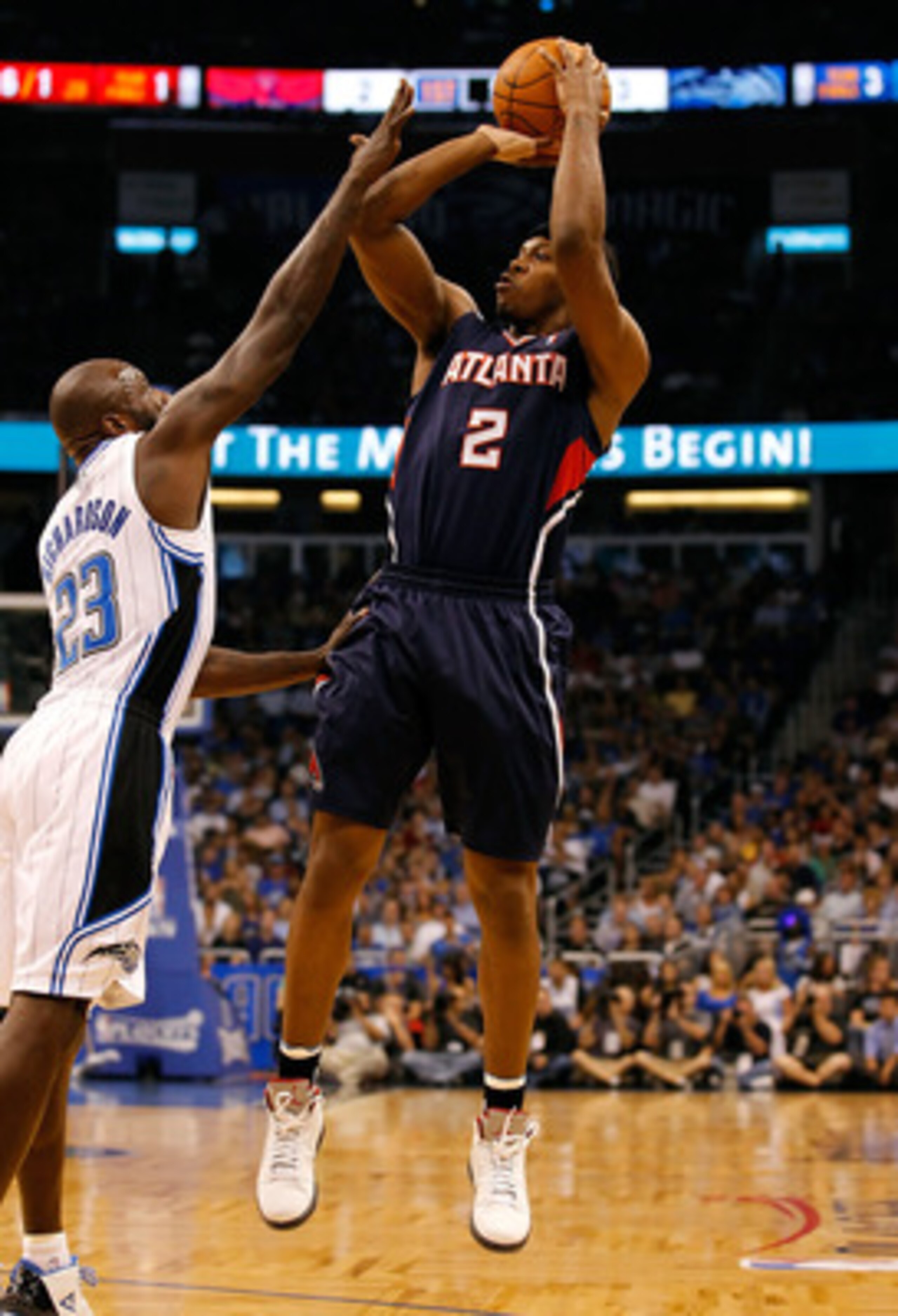 ORLANDO, FL - APRIL 26:  Joe Johnson #2 of the Atlanta Hawks shoots over Jason Richardson #23 of the Orlando Magic during Game Five of the Eastern Conference Quarterfinals of the 2011 NBA Playoffs on April 26, 2011 at the Amway Arena in Orlando, Florida. 