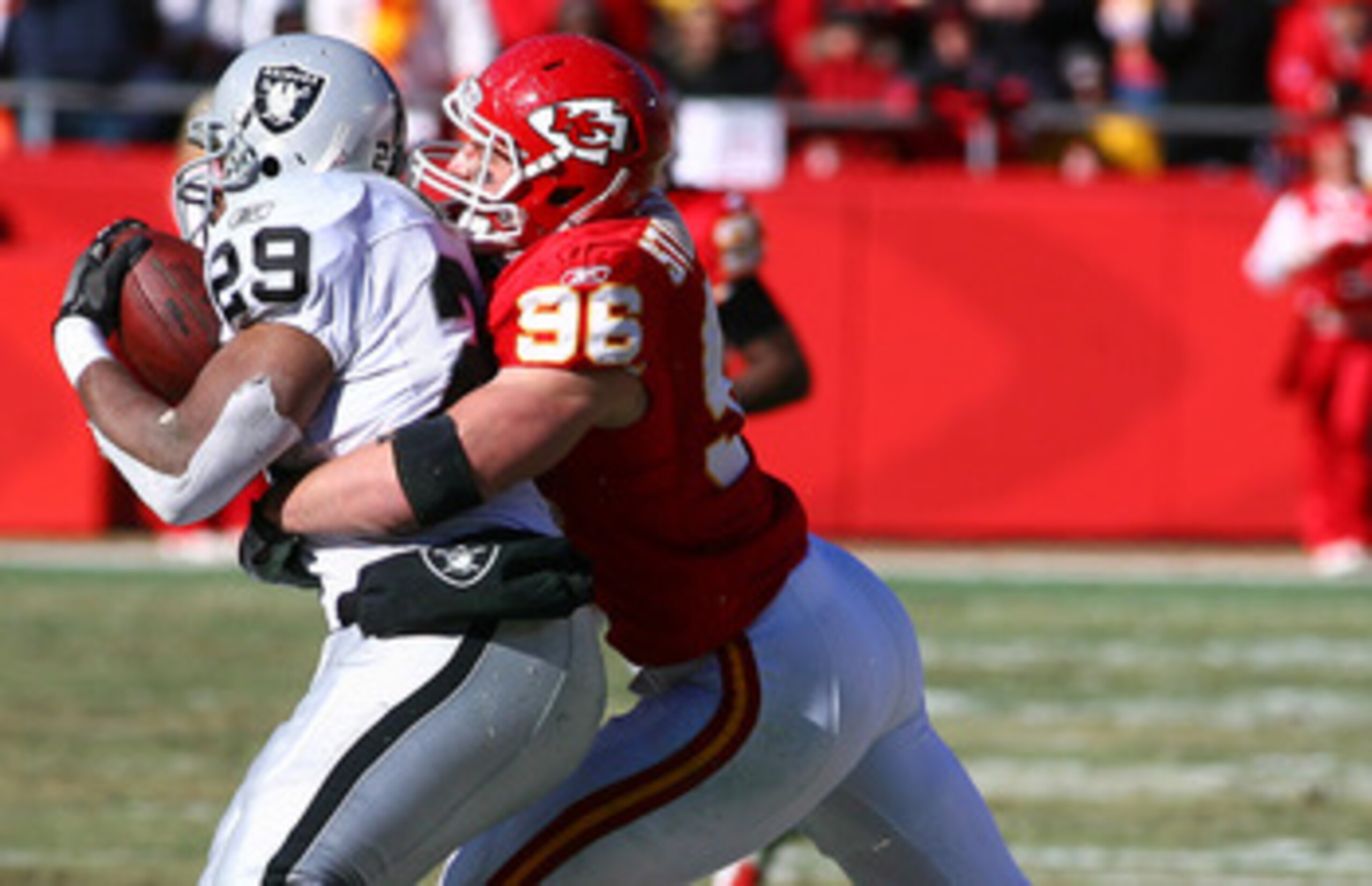 KANSAS CITY, MO - JANUARY 02:  Running back Michael Bush #29 of the Oakland Raiders is tackled by linebacker Andy Studebaker #96 of the Kansas City Chiefs in a game at Arrowhead Stadium on January 2, 2011 in Kansas City, Missouri.  (Photo by Tim Umphrey/G