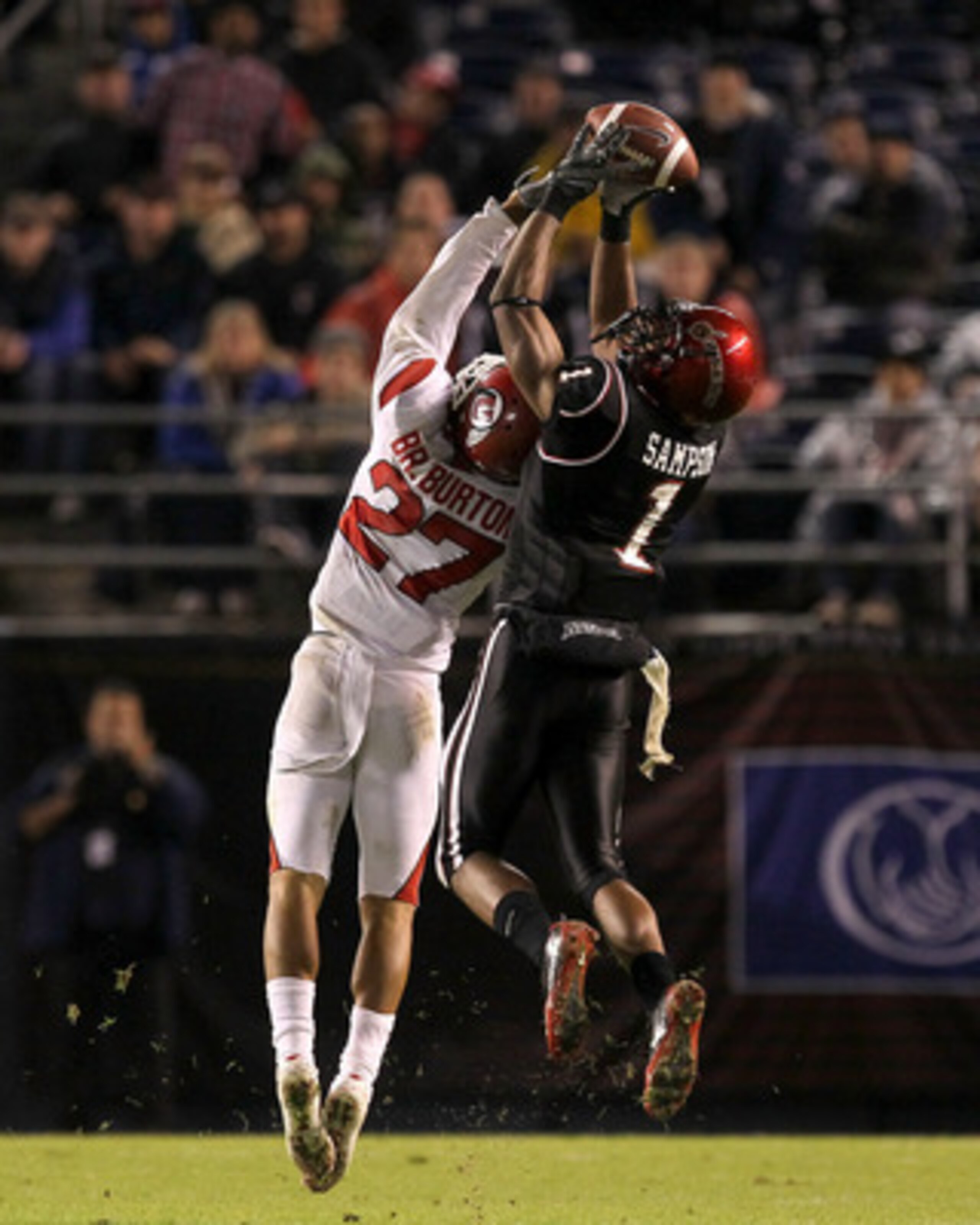 SAN DIEGO - NOVEMBER 20: Wide receiver DeMarco Sampson #1 of the San Diego State Aztecs makes a catch over cornerback Brandon Burton #27 of the Utah Utes at Qualcomm Stadium on November 20, 2010 in San Diego, California. Utah won 38-34. (Photo by Steph SAN DIEGO - NOVEMBER 20: Wide receiver DeMarco Sampson #1 of the San Diego State Aztecs makes a catch over cornerback Brandon Burton #27 of the Utah Utes at Qualcomm Stadium on November 20, 2010 in San Diego, California. Utah won 38-34. (Photo by Steph