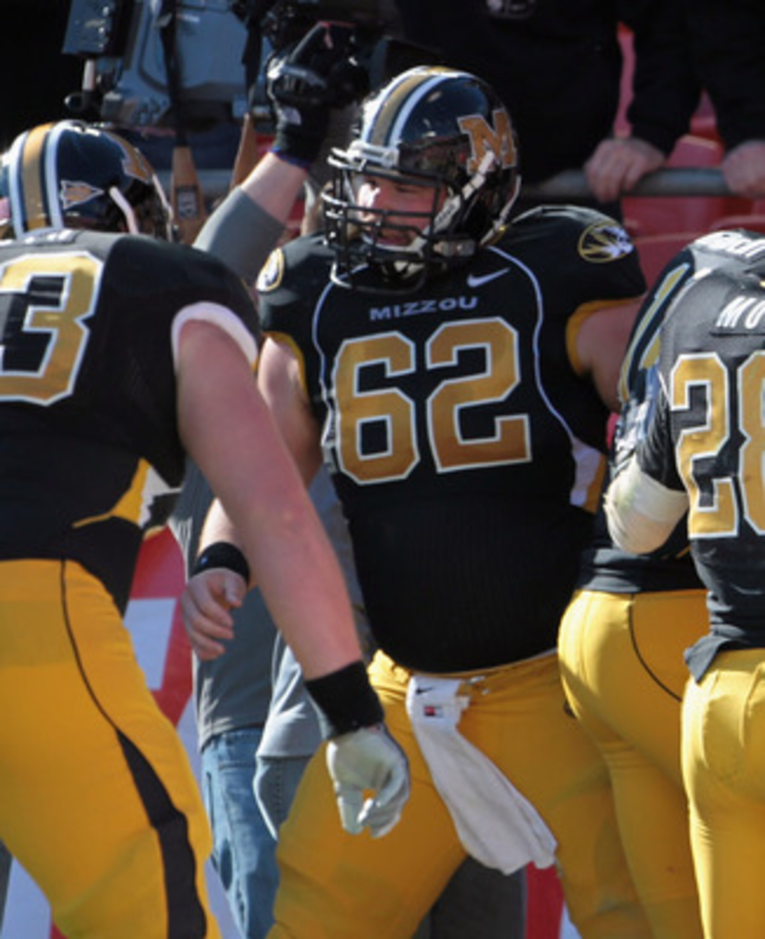 KANSAS CITY, MO - NOVEMBER 27:  Kendial Lawrence #4 of the Missouri Tigers is congratulated after scoring a touchdown during the game against the Kansas Jayhawks on November 27, 2010 at Arrowhead Stadium in Kansas City, Missouri.  (Photo by Jamie Squire/G