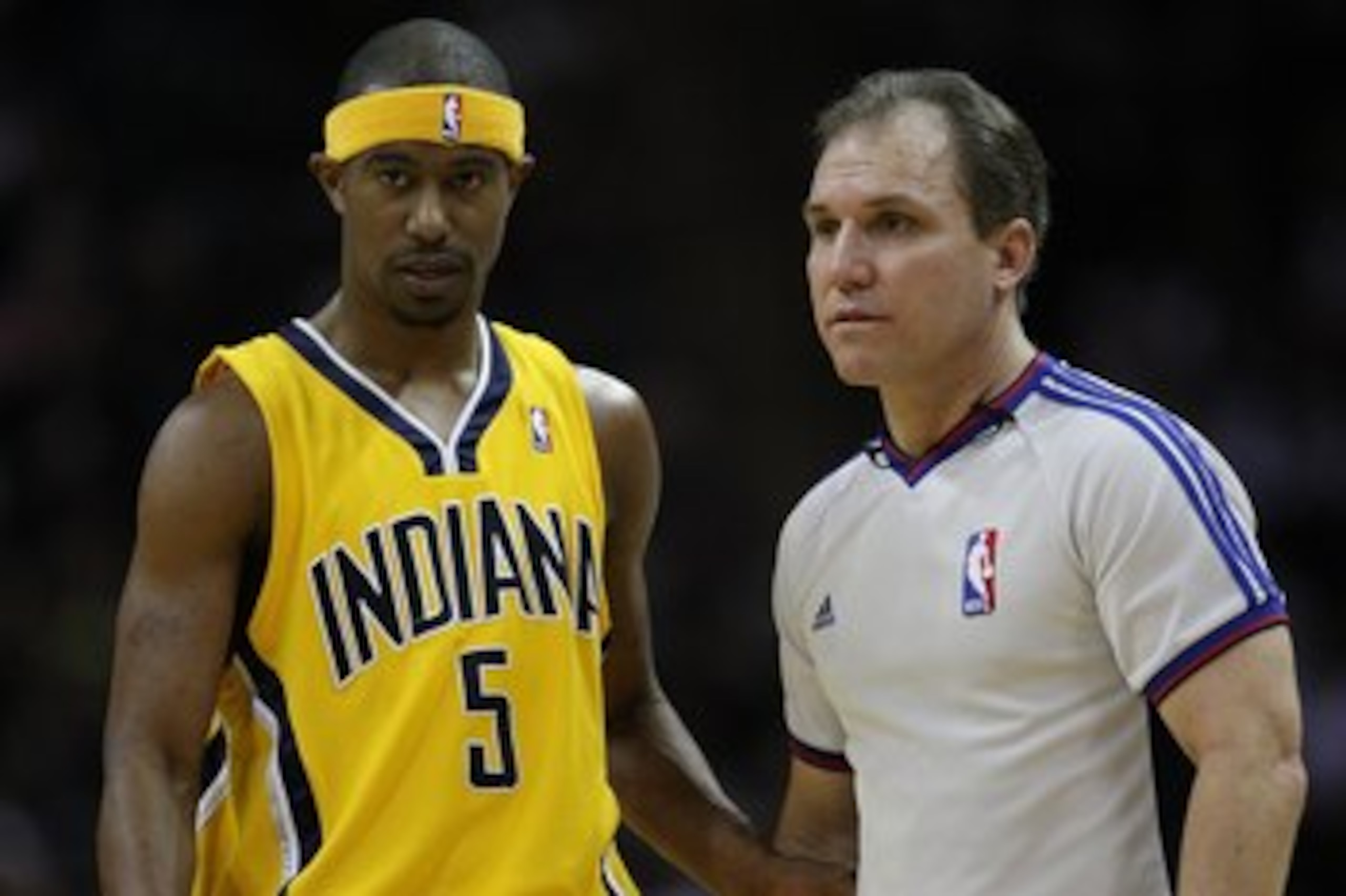 SAN ANTONIO - JANUARY 20:  NBA official Ron Garretson #8 with T.J. Ford #5 of the Indiana Pacers during play against the San Antonio Spurs on January 20, 2009 at AT&T Center in San Antonio, Texas.  NOTE TO USER: User expressly acknowledges and agrees that