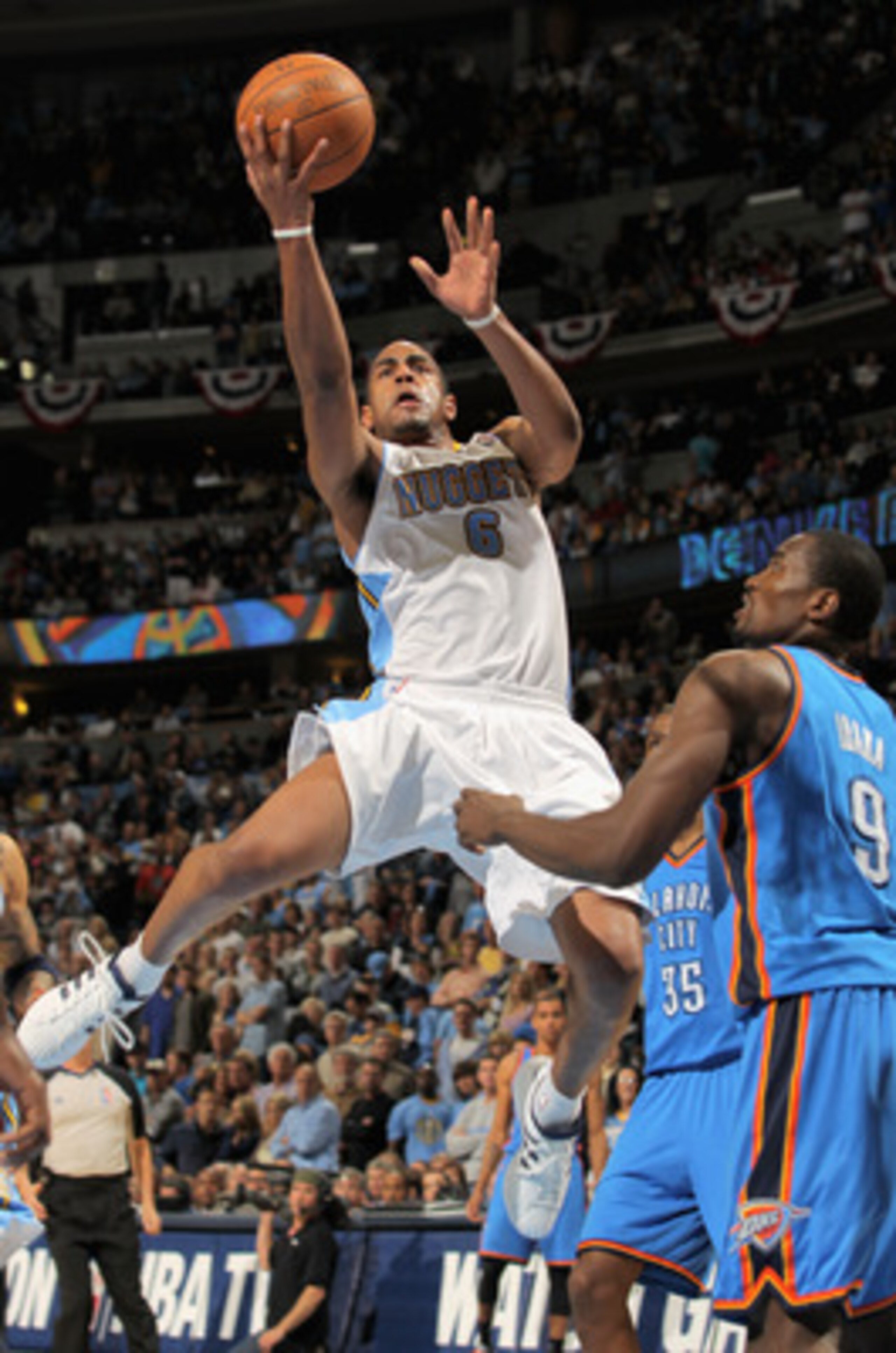 DENVER, CO - APRIL 23:  Arron Afflalo #6 of the Denver Nuggets lays up a shot over Serge Ibaka #9 of the Oklahoma City Thunder in Game Three of the Western Conference Quarterfinals in the 2011 NBA Playoffs on April 23, 2011 at the Pepsi Center in Denver, 