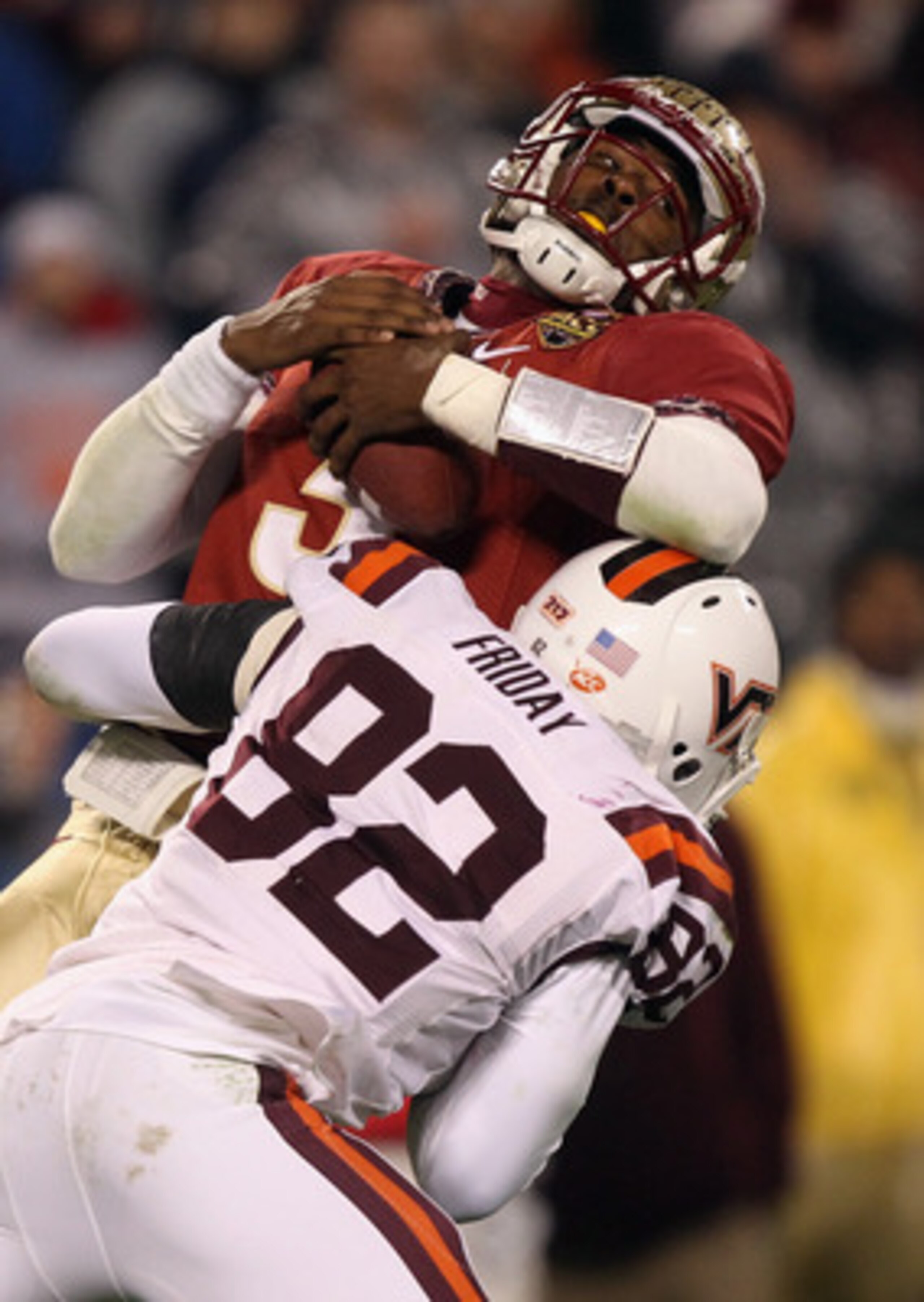 CHARLOTTE, NC - DECEMBER 04:  EJ Manuel #3 of the Florida State Seminoles is sacked by Steven Friday #82 of the Virginia Tech Hokies during their game at Bank of America Stadium on December 4, 2010 in Charlotte, North Carolina.  (Photo by Streeter Lecka/G