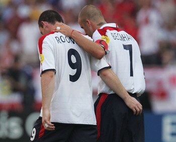 COIMBRA, PORTUGAL - JUNE 17:  Wayne Rooney of England is congratulated by his captain David Beckham after he scores their second goal during the UEFA Euro 2004 Group B match between England and Switzerland at the Estadio Cidade de Coimbra on June 17, 2004