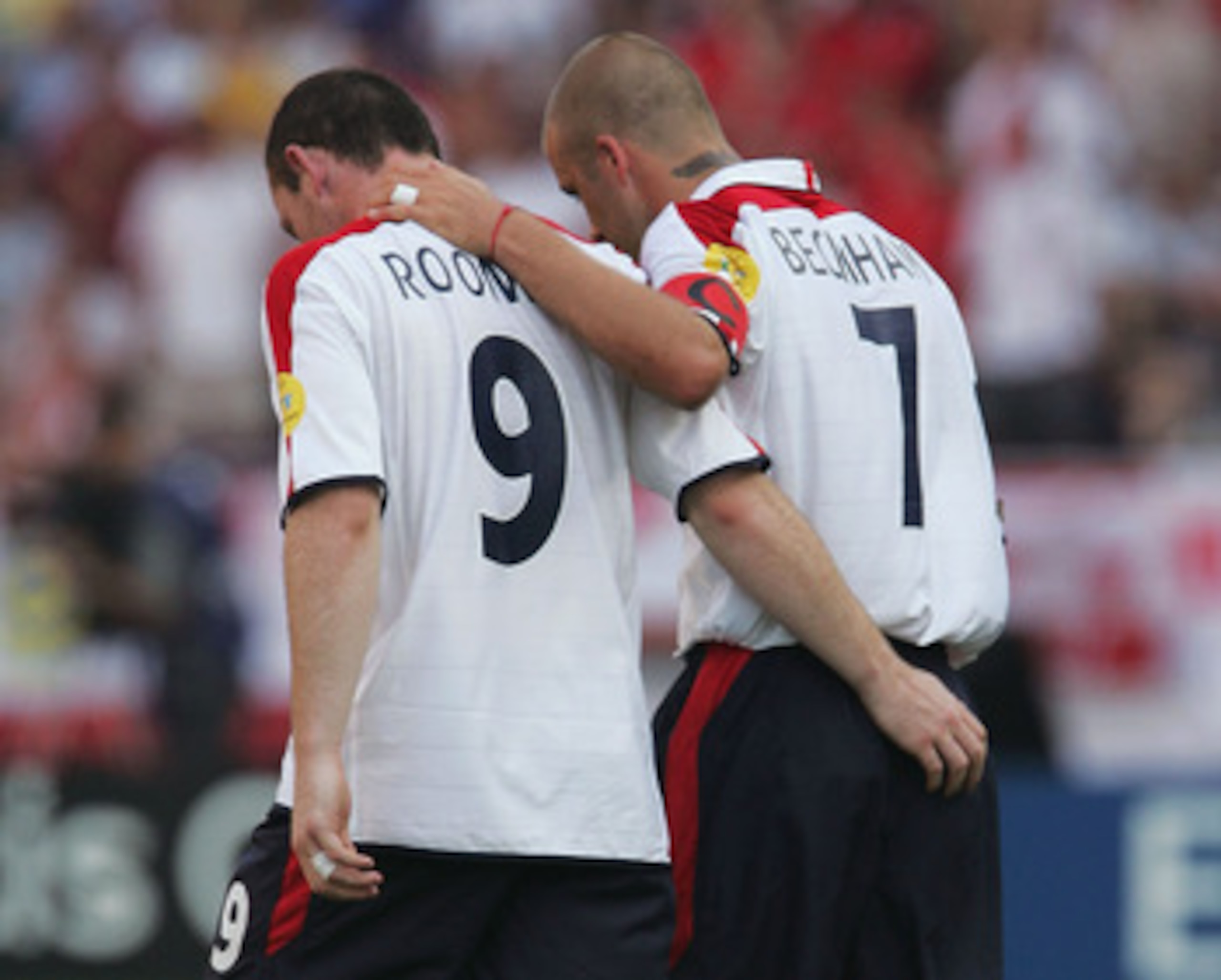 COIMBRA, PORTUGAL - JUNE 17: Wayne Rooney of England is congratulated by his captain David Beckham after he scores their second goal during the UEFA Euro 2004 Group B match between England and Switzerland at the Estadio Cidade de Coimbra on June 17, 2004 COIMBRA, PORTUGAL - JUNE 17: Wayne Rooney of England is congratulated by his captain David Beckham after he scores their second goal during the UEFA Euro 2004 Group B match between England and Switzerland at the Estadio Cidade de Coimbra on June 17, 2004