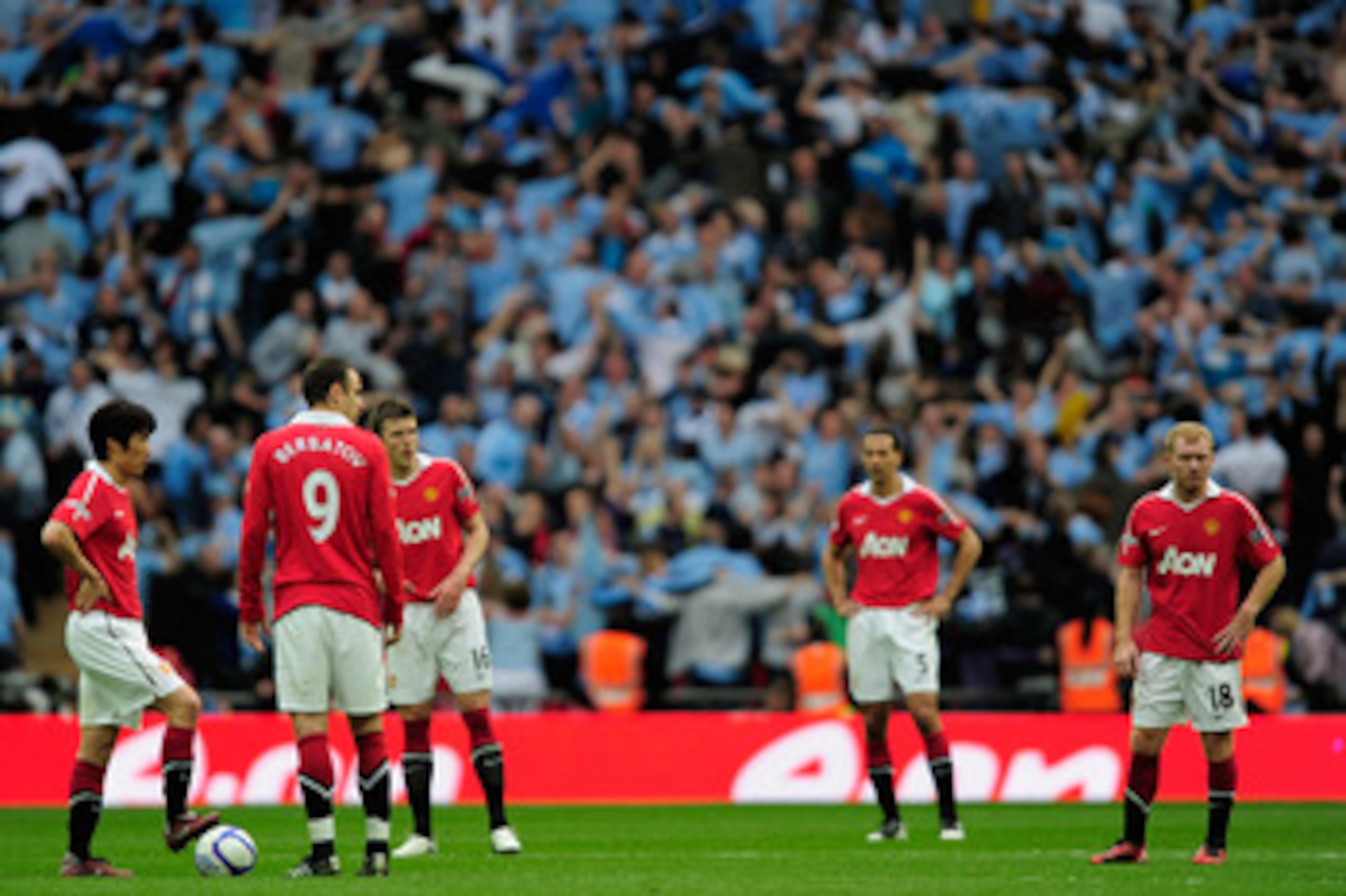 LONDON, ENGLAND - APRIL 16: Man Utd players react after Yaya Toure of Manchester City scored the opening goal during the FA Cup sponsored by E.ON semi final match between Manchester City and Manchester United at Wembley Stadium on April 16, 2011 in Londo LONDON, ENGLAND - APRIL 16: Man Utd players react after Yaya Toure of Manchester City scored the opening goal during the FA Cup sponsored by E.ON semi final match between Manchester City and Manchester United at Wembley Stadium on April 16, 2011 in Londo