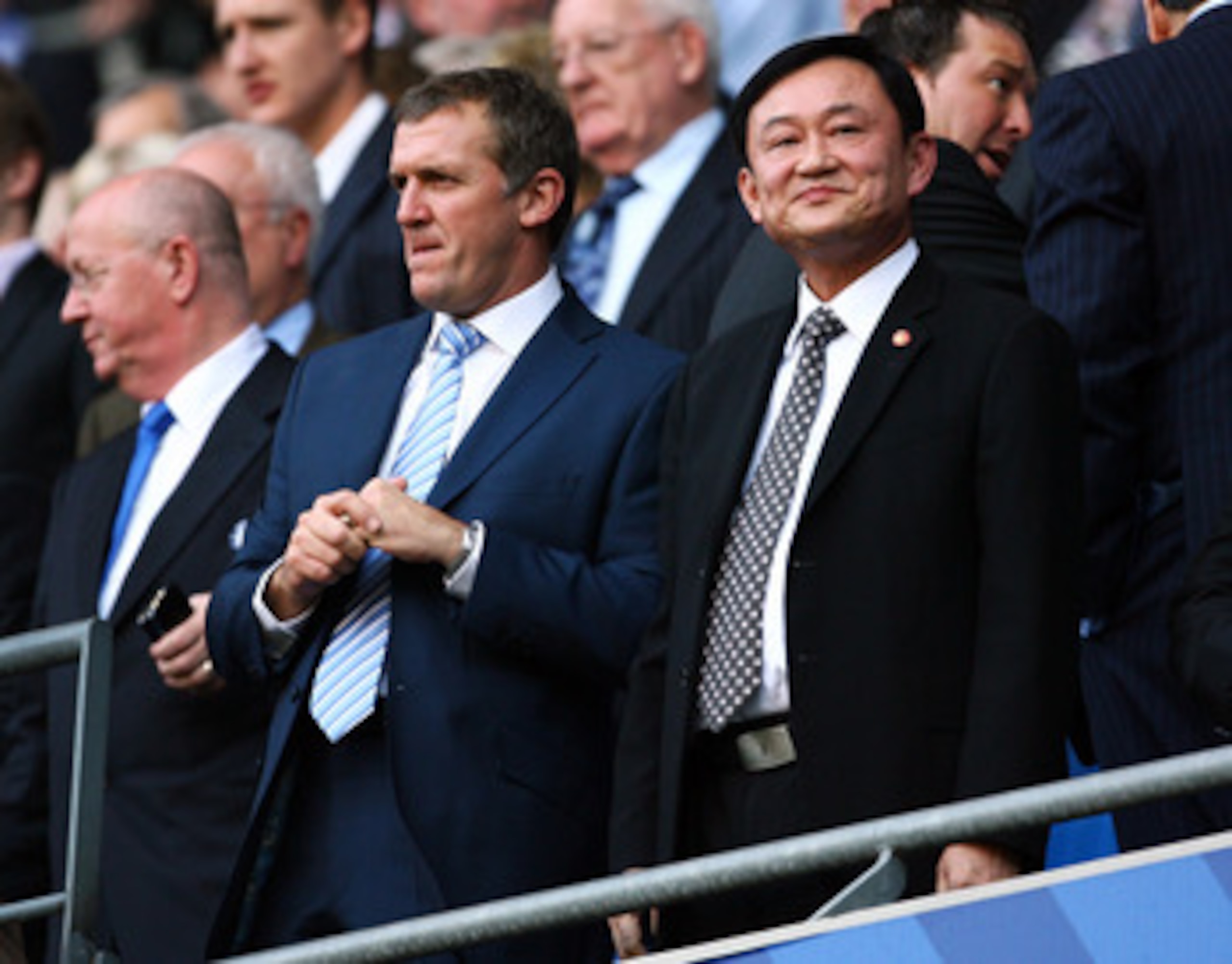 MANCHESTER, UNITED KINGDOM - SEPTEMBER 13: Thaksin Shinawatra looks on during the Barclays Premier League match between Manchester City and Chelsea at The City of Manchester Stadium on September 13, 2008 in Manchester, England. (Photo by Alex Livesey/Get MANCHESTER, UNITED KINGDOM - SEPTEMBER 13: Thaksin Shinawatra looks on during the Barclays Premier League match between Manchester City and Chelsea at The City of Manchester Stadium on September 13, 2008 in Manchester, England. (Photo by Alex Livesey/Get