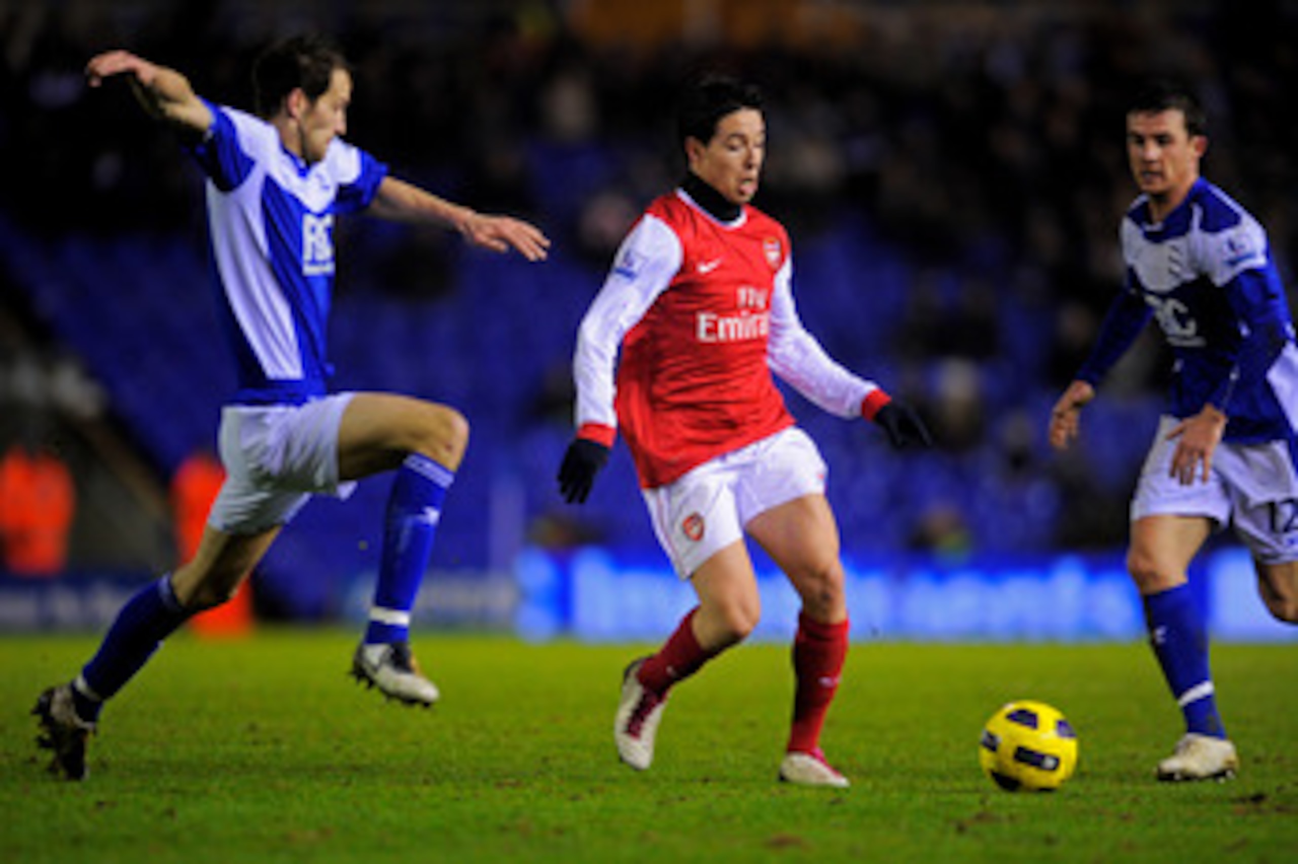 BIRMINGHAM, ENGLAND - JANUARY 01: Samir Nasri of Arsenal is challenged by Roger Johnson of Birmingham during the Barclays Premier Leaue match between Birmingham City and Arsenal at St. Andrews on January 1, 2011 in Birmingham, England. (Photo by Michael BIRMINGHAM, ENGLAND - JANUARY 01: Samir Nasri of Arsenal is challenged by Roger Johnson of Birmingham during the Barclays Premier Leaue match between Birmingham City and Arsenal at St. Andrews on January 1, 2011 in Birmingham, England. (Photo by Michael