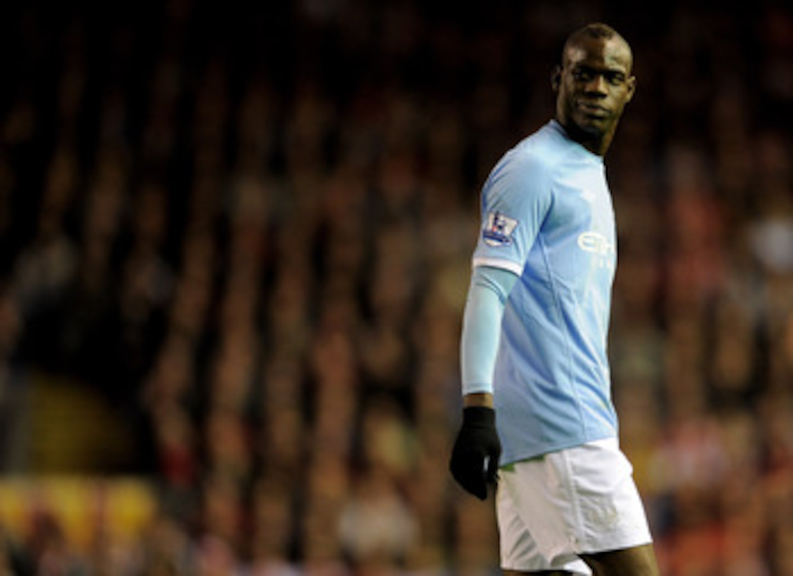 LIVERPOOL, ENGLAND - APRIL 11: Mario Balotelli of Manchester City looks on during the Barclays Premier League match between Liverpool and Manchester City at Anfield on April 11, 2011 in Liverpool, England. (Photo by Michael Regan/Getty Images) LIVERPOOL, ENGLAND - APRIL 11: Mario Balotelli of Manchester City looks on during the Barclays Premier League match between Liverpool and Manchester City at Anfield on April 11, 2011 in Liverpool, England. (Photo by Michael Regan/Getty Images)