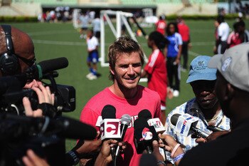 PORT OF SPAIN, TRINIDAD AND TOBAGO - SEPTEMBER 26:  David Beckham and FIFA Vice President and CONCACAF President Jack Warner speak to media during a Training Session for local players at the Marvin Lee Stadium on September 26, 2010 in Macoya, Trinidad And