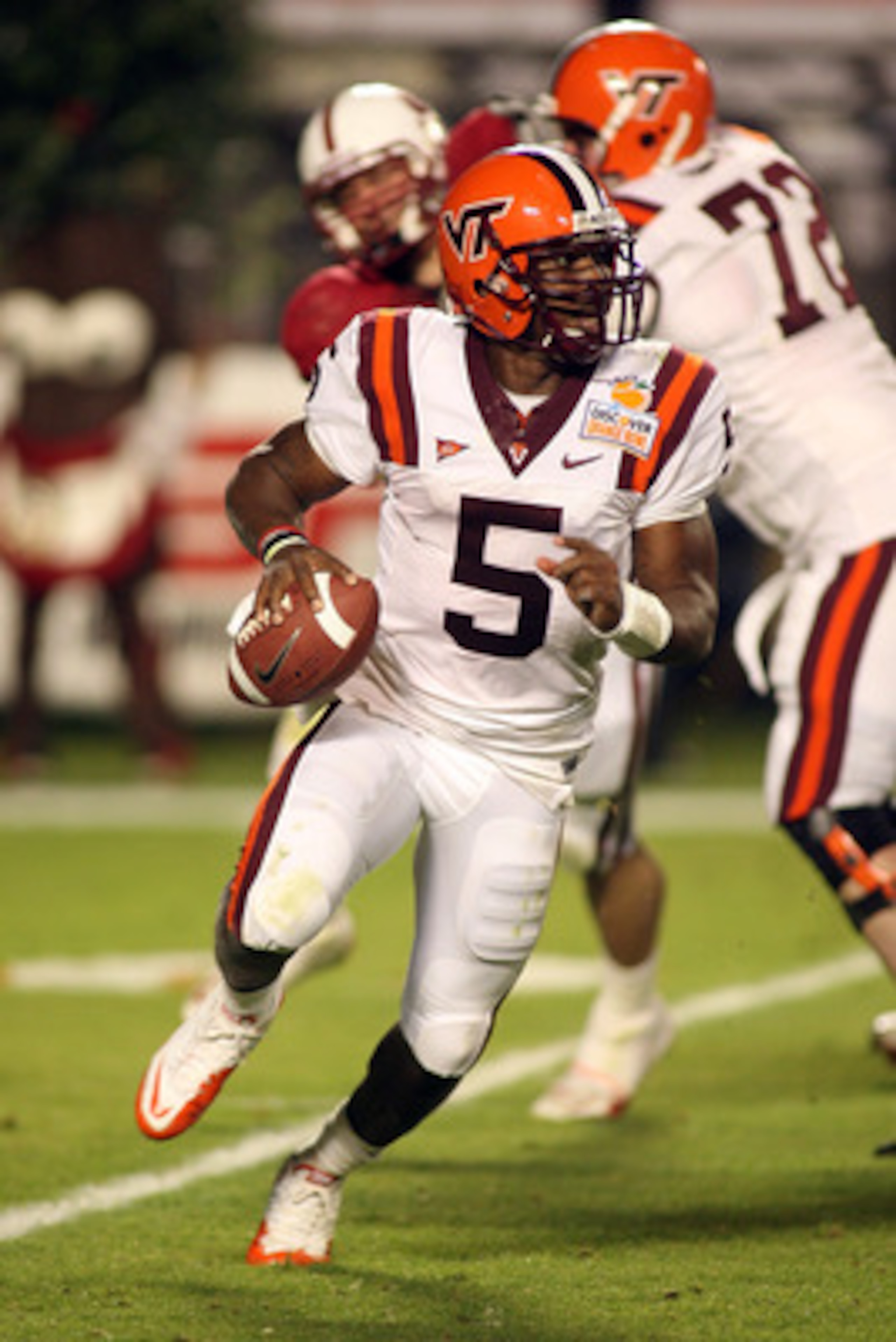 MIAMI, FL - JANUARY 03:  Tyrod Taylor #5 of the Virginia Tech Hokies rolls out of the pocket against the Stanford Cardinal during the 2011 Discover Orange Bowl at Sun Life Stadium on January 3, 2011 in Miami, Florida. Stanford won 40-12. (Photo by Marc Se