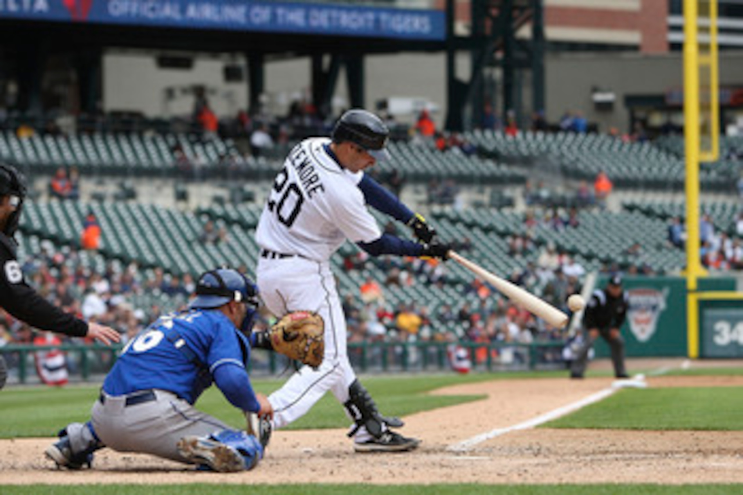 DETROIT - APRIL 13: Scott Sizemore #20 of the Detroit Tigers doubles down the left field line in the seventh inning scoring Gerald Laird #8 from second base against the Kansas City Royals on April 13, 2010 at Comerica Park in Detroit, Michigan. The Detroi DETROIT - APRIL 13: Scott Sizemore #20 of the Detroit Tigers doubles down the left field line in the seventh inning scoring Gerald Laird #8 from second base against the Kansas City Royals on April 13, 2010 at Comerica Park in Detroit, Michigan. The Detroi