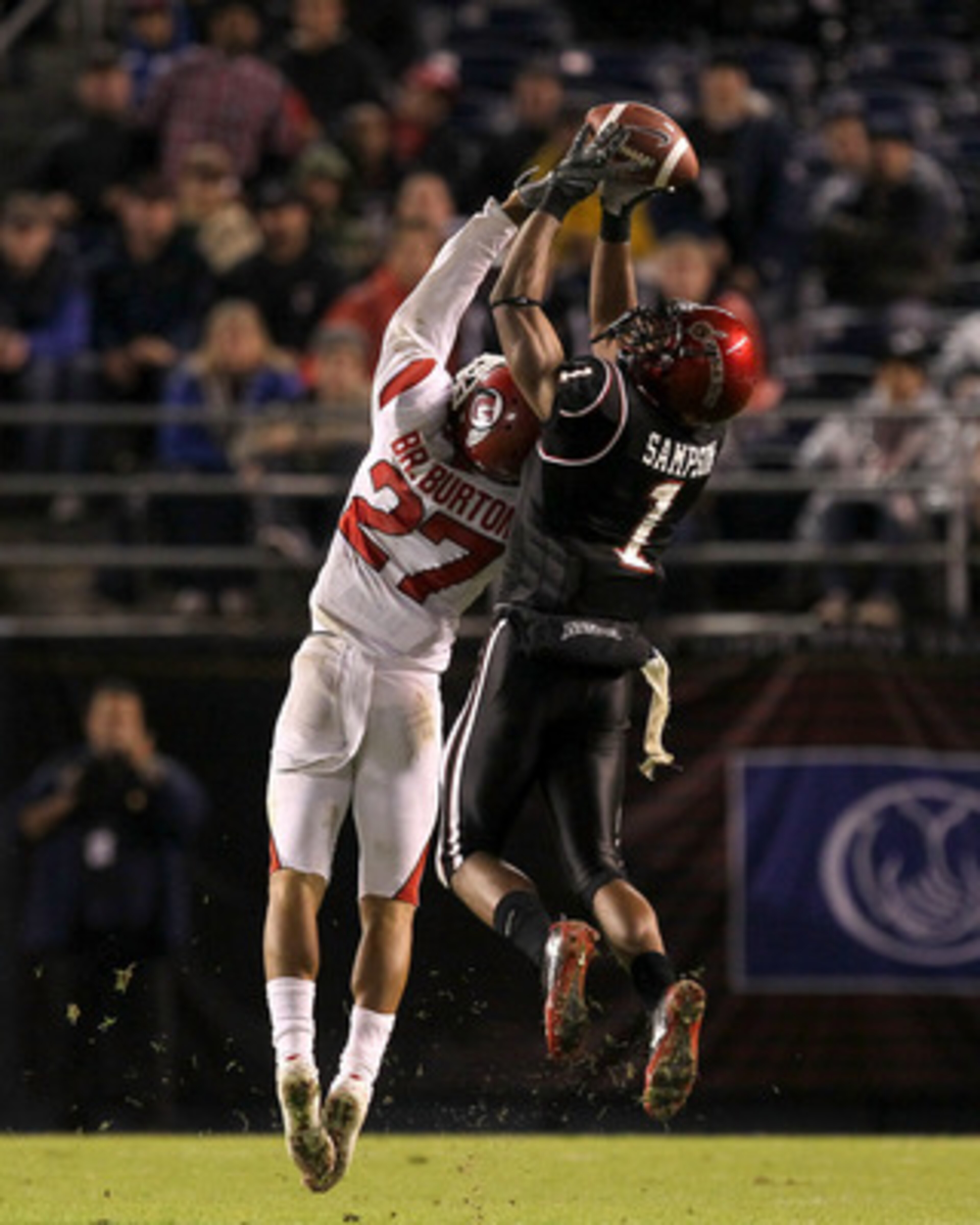 SAN DIEGO - NOVEMBER 20: Wide receiver DeMarco Sampson #1 of the San Diego State Aztecs makes a catch over cornerback Brandon Burton #27 of the Utah Utes at Qualcomm Stadium on November 20, 2010 in San Diego, California. Utah won 38-34. (Photo by Steph SAN DIEGO - NOVEMBER 20: Wide receiver DeMarco Sampson #1 of the San Diego State Aztecs makes a catch over cornerback Brandon Burton #27 of the Utah Utes at Qualcomm Stadium on November 20, 2010 in San Diego, California. Utah won 38-34. (Photo by Steph