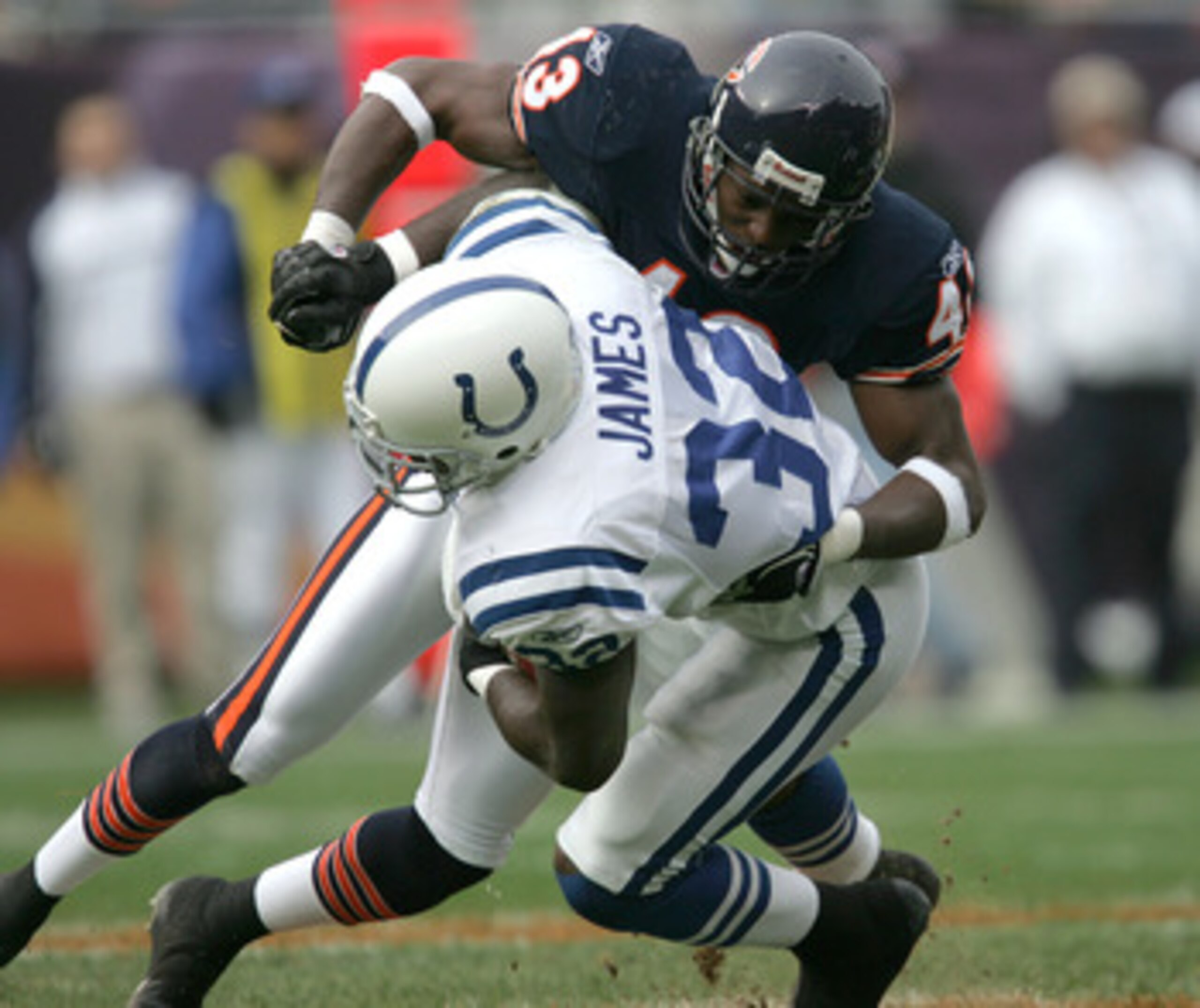 CHICAGO - NOVEMBER 21:  Mike Green #43 of the Chicago Bears tackles Edgerrin James #32 of the Indianapolis Colts on November 21, 2004 at Soldier Field in Chicago, Illinois.  (Photo by Jonathan Daniel/Getty Images)