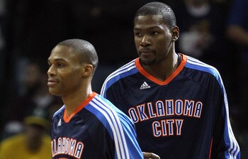 CHARLOTTE, NC - DECEMBER 21: Teammates Kevin Durant #35 and Russell Westbrook #0 of the Oklahoma Thunder warmup before the start of their game against the Charlotte Bobcats at Time Warner Cable Arena on December 21, 2010 in Charlotte, North Carolina. NOT CHARLOTTE, NC - DECEMBER 21: Teammates Kevin Durant #35 and Russell Westbrook #0 of the Oklahoma Thunder warmup before the start of their game against the Charlotte Bobcats at Time Warner Cable Arena on December 21, 2010 in Charlotte, North Carolina. NOT