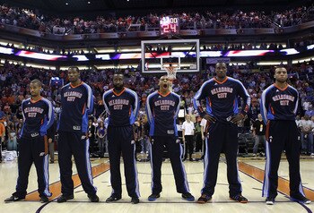 PHOENIX, AZ - MARCH 30: The Oklahoma City Thunder stand attended before the NBA game against the Phoenix Suns at US Airways Center on March 30, 2011 in Phoenix, Arizona. The Thunder defeated the Suns 116-98. NOTE TO USER: User expressly acknowledges an PHOENIX, AZ - MARCH 30: The Oklahoma City Thunder stand attended before the NBA game against the Phoenix Suns at US Airways Center on March 30, 2011 in Phoenix, Arizona. The Thunder defeated the Suns 116-98. NOTE TO USER: User expressly acknowledges an