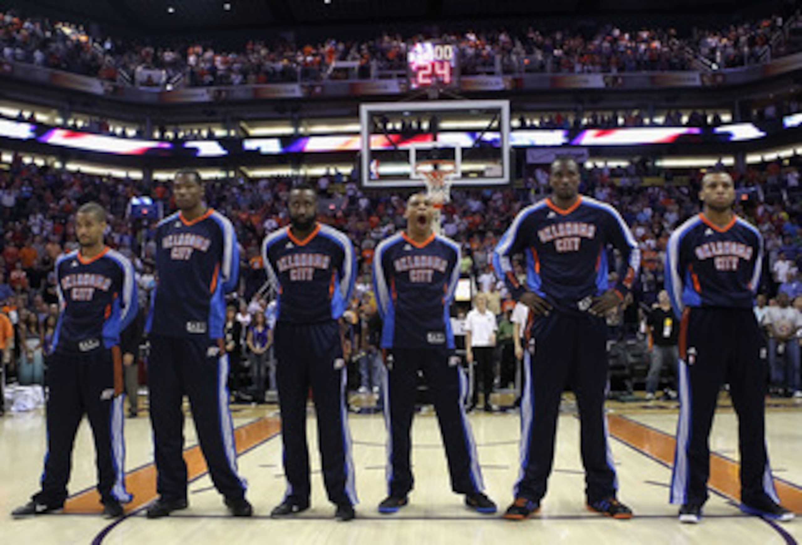 PHOENIX, AZ - MARCH 30: The Oklahoma City Thunder stand attended before the NBA game against the Phoenix Suns at US Airways Center on March 30, 2011 in Phoenix, Arizona. The Thunder defeated the Suns 116-98. NOTE TO USER: User expressly acknowledges an PHOENIX, AZ - MARCH 30: The Oklahoma City Thunder stand attended before the NBA game against the Phoenix Suns at US Airways Center on March 30, 2011 in Phoenix, Arizona. The Thunder defeated the Suns 116-98. NOTE TO USER: User expressly acknowledges an