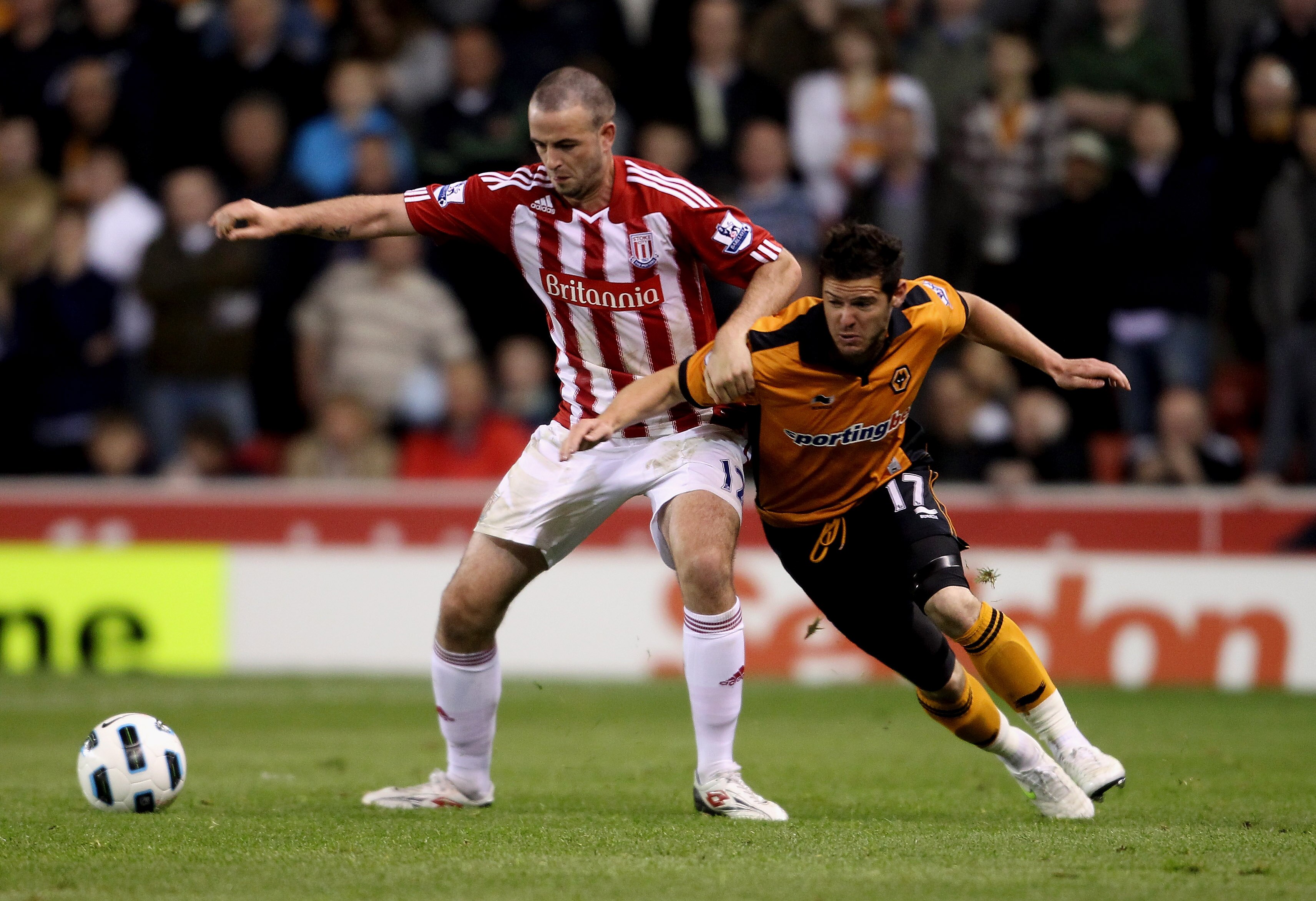 STOKE ON TRENT, ENGLAND - APRIL 26:  Marc Wilson of Stoke City (L) in action with Matt Jarvis of Wolves in action during the Barclays Premier League match between Stoke City and Wolverhampton Wanderers at Britannia Stadium on April 26, 2011 in Stoke on Tr