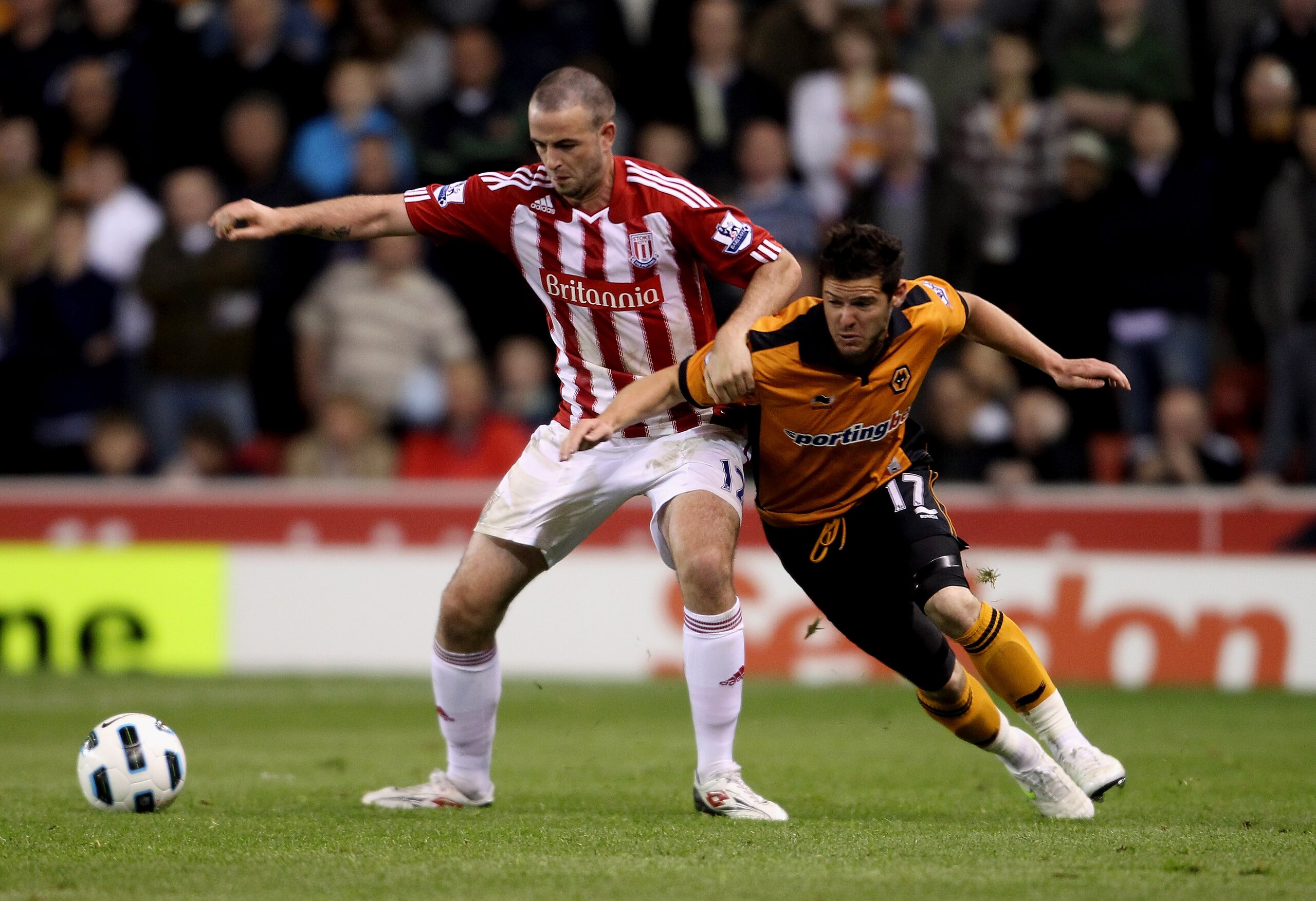 STOKE ON TRENT, ENGLAND - APRIL 26:  Marc Wilson of Stoke City (L) in action with Matt Jarvis of Wolves in action during the Barclays Premier League match between Stoke City and Wolverhampton Wanderers at Britannia Stadium on April 26, 2011 in Stoke on Tr