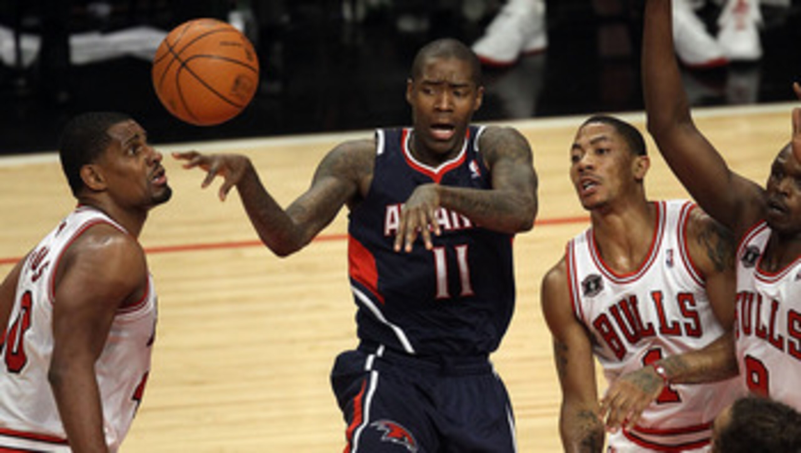CHICAGO, IL - MARCH 11: Jamal Crawford #11 of the Atlanta Hawks passes the ball surrounded by (L-R) Kurt Thomas #40, Derrick Rose #1, Loul Deng #9 and Joakim Noah #13 of the Chicago Bulls at the United Center on March 11, 2011 in Chicago, Illinois. The B CHICAGO, IL - MARCH 11: Jamal Crawford #11 of the Atlanta Hawks passes the ball surrounded by (L-R) Kurt Thomas #40, Derrick Rose #1, Loul Deng #9 and Joakim Noah #13 of the Chicago Bulls at the United Center on March 11, 2011 in Chicago, Illinois. The B