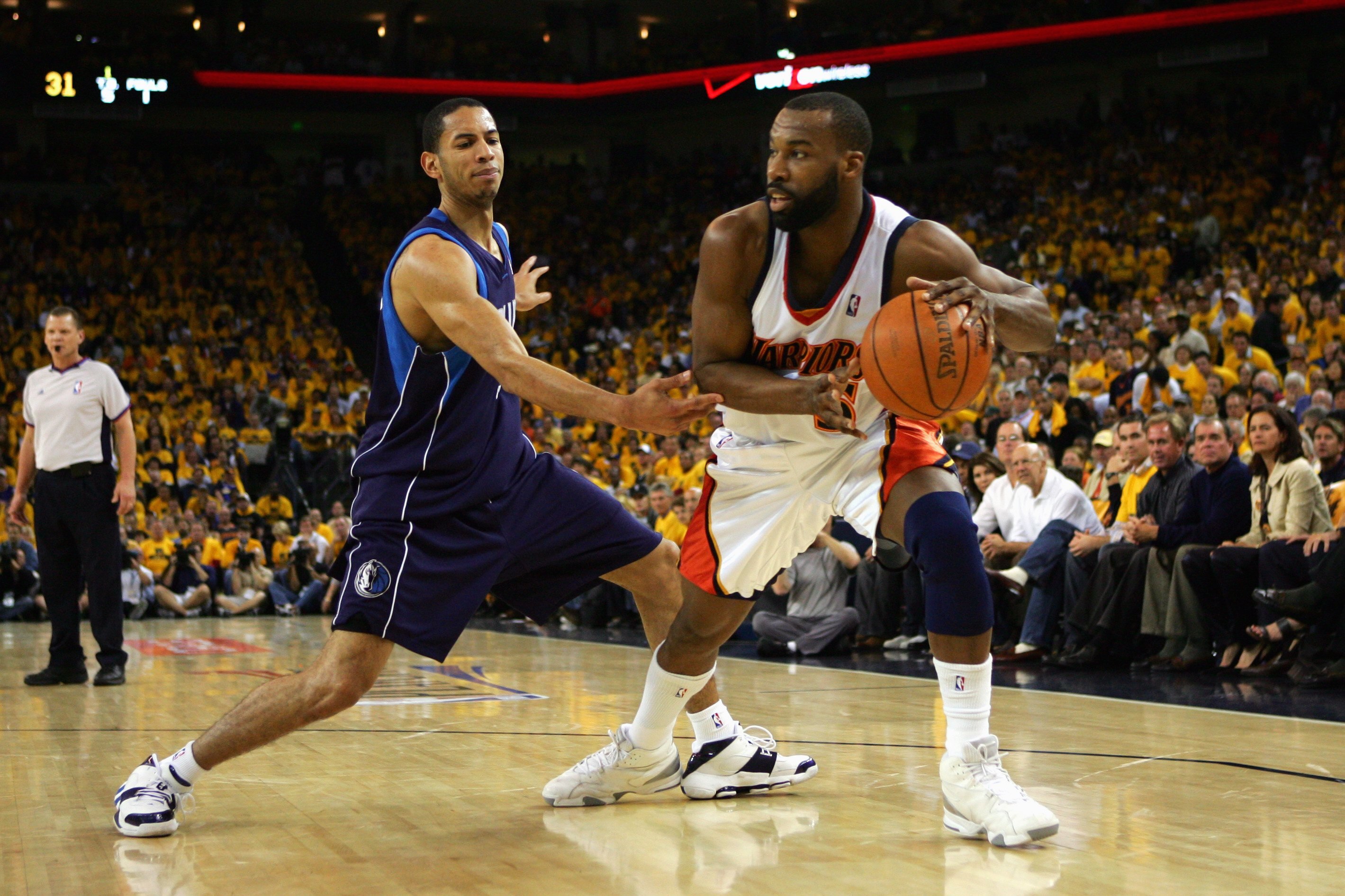 OAKLAND, CA - MAY 3:  Baron Davis #5 of the Golden State Warriors moves the ball against Devin Harris #34 of the Dallas Mavericks in Game Six of the Western Conference Quarterfinals during the 2007 NBA Playoffs on May 3, 2007 at Oracle Arena in Oakland, C