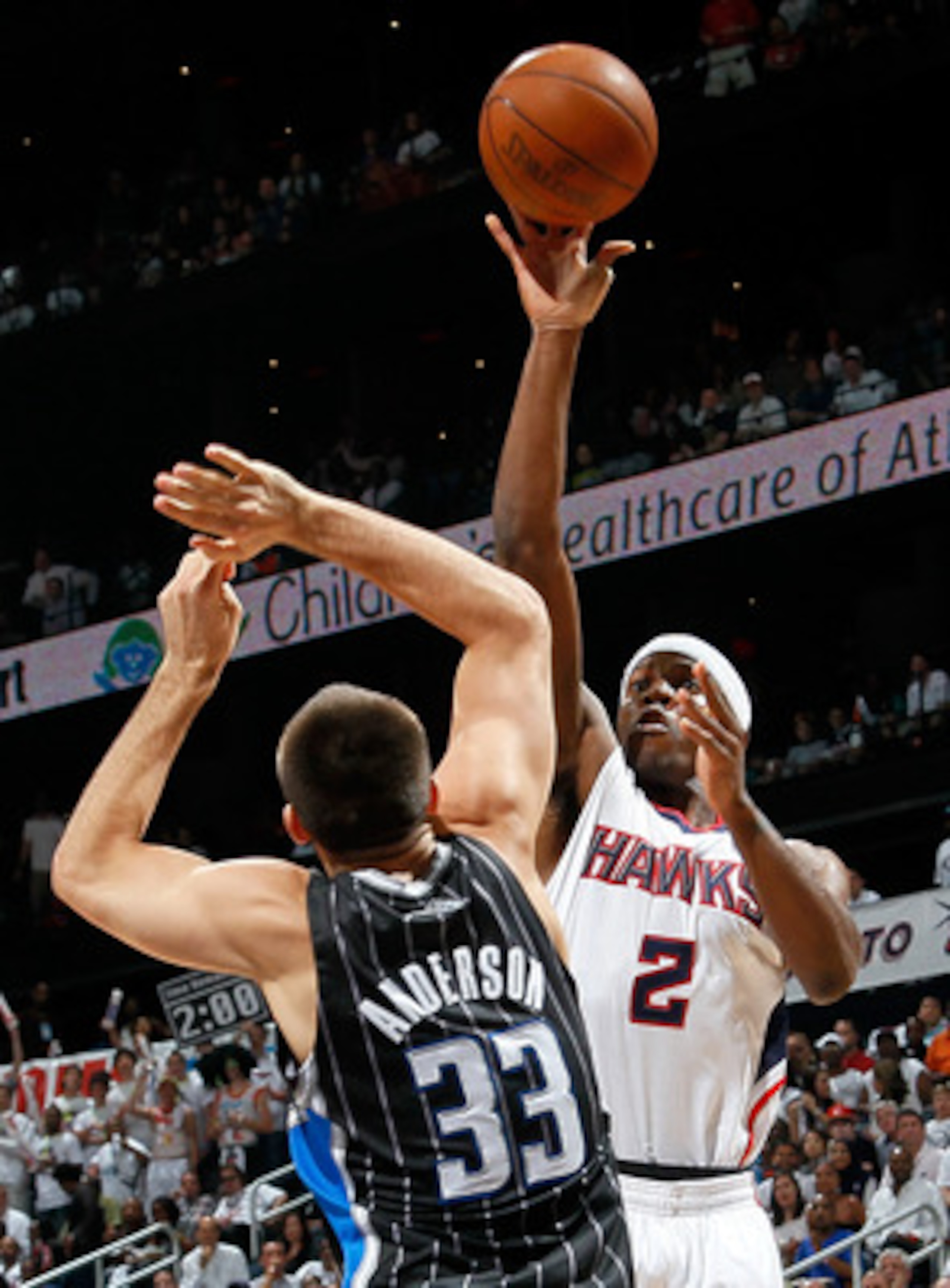 ATLANTA, GA - APRIL 24: Joe Johnson #2 of the Atlanta Hawks shoots over Ryan Anderson #33 of the Orlando Magic during Game Four of the Eastern Conference Quarterfinals in the 2011 NBA Playoffs at Philips Arena on April 24, 2011 in Atlanta, Georgia. NOTE ATLANTA, GA - APRIL 24: Joe Johnson #2 of the Atlanta Hawks shoots over Ryan Anderson #33 of the Orlando Magic during Game Four of the Eastern Conference Quarterfinals in the 2011 NBA Playoffs at Philips Arena on April 24, 2011 in Atlanta, Georgia. NOTE