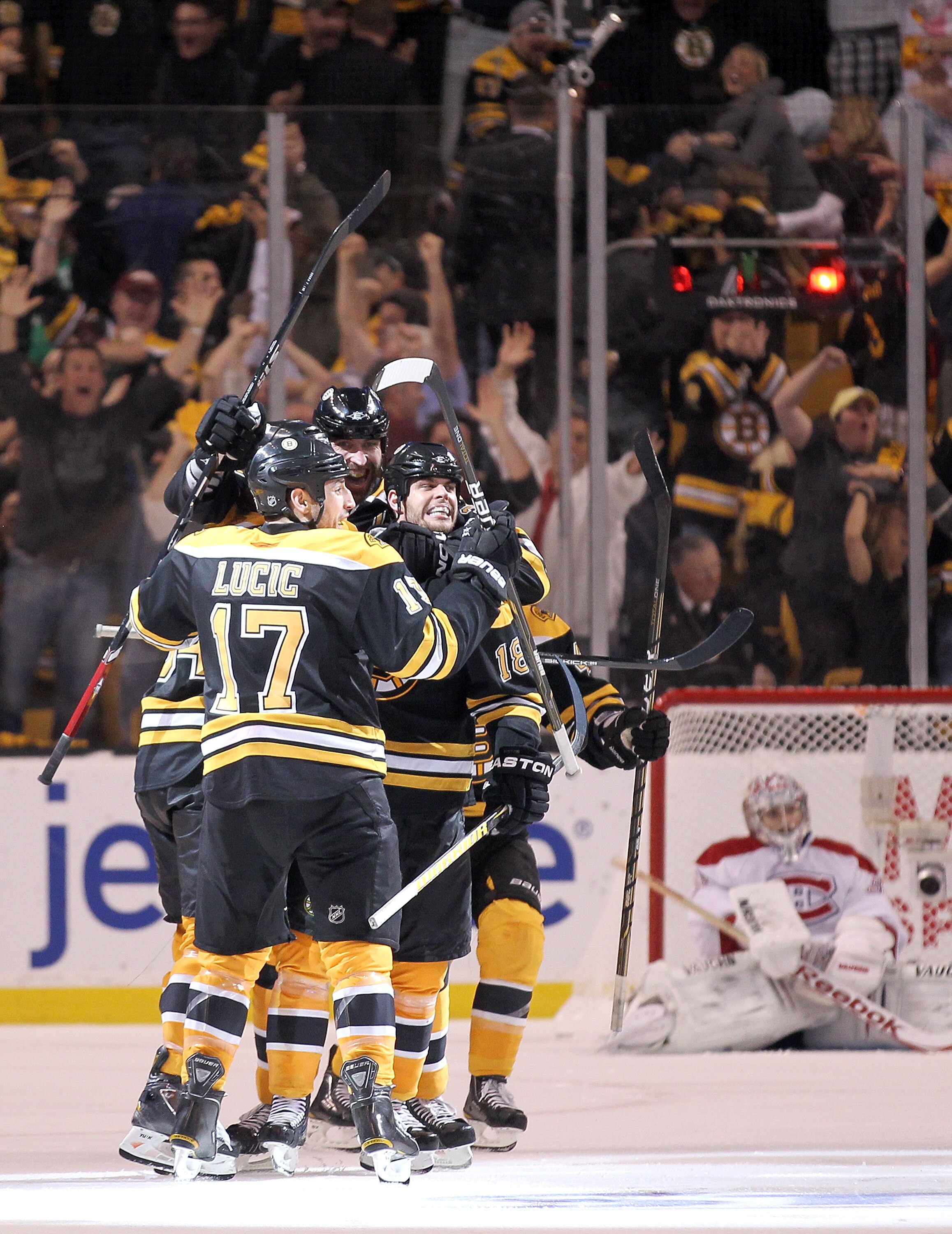 BOSTON, MA - APRIL 27: Nathan Horton #18 of the Boston Bruins celebrates with teammates after he scored the winning goal in overtime against the Montreal Canadiens in Game Seven of the Eastern Conference Quarterfinals during the 2011 NHL Stanley Cup Playo