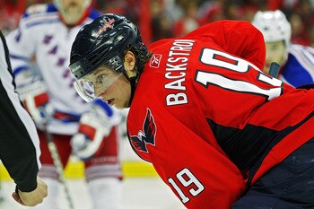 WASHINGTON , DC - APRIL 23:  Nicklas Backstrom #19 of the Washington Capitals looks on during a face off against of the New York Rangers in Game Five of the Eastern Conference Quarterfinals during the 2011 NHL Stanley Cup Playoffs at the Verizon Center on