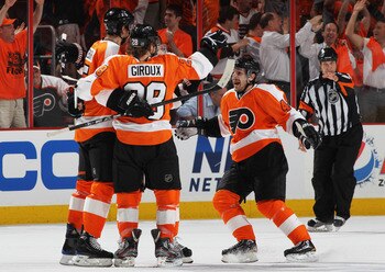 PHILADELPHIA, PA - APRIL 26:  Braydon Coburn #5, Claude Giroux #28 and Danny Briere #48 of the Philadelphia Flyers celebrate a first period goal against the Buffalo Sabres in Game Seven of the Eastern Conference Quarterfinals during the 2011 NHL Stanley C