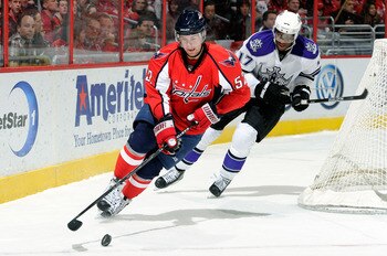 WASHINGTON, DC - FEBRUARY 12:  Mike Green #52 of the Washington Capitals handles the puck against Wayne Simmonds #17 of the Los Angeles Kings at the Verizon Center on February 12, 2011 in Washington, DC.  (Photo by Greg Fiume/Getty Images)