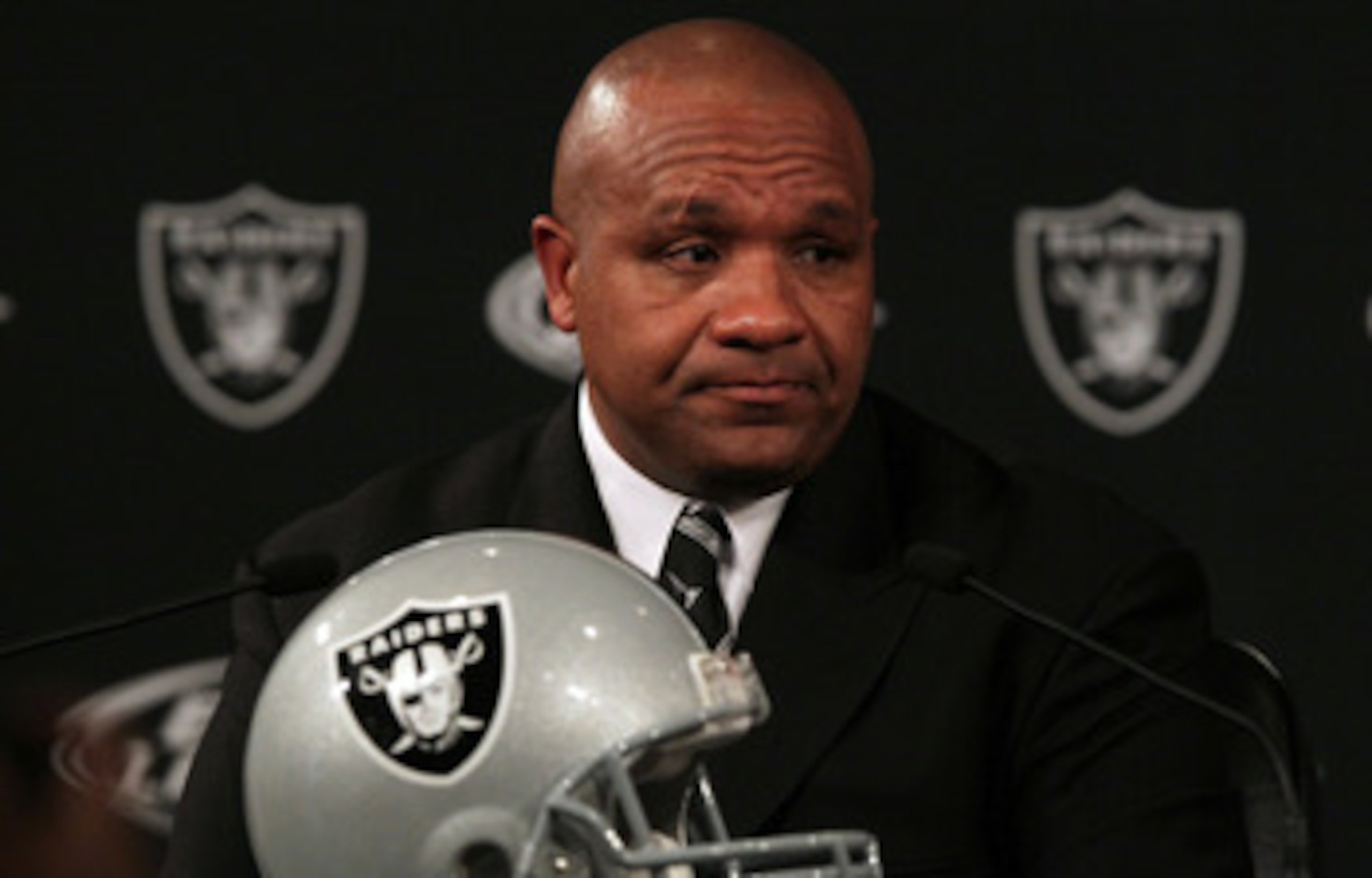 ALAMEDA, CA - JANUARY 18:  New Oakland Raiders coach Hue Jackson pauses as he speaks to reporters during a press conference on January 18, 2011 in Alameda, California. Hue Jackson was introduced as the new coach of the Oakland Raiders, replacing the fired