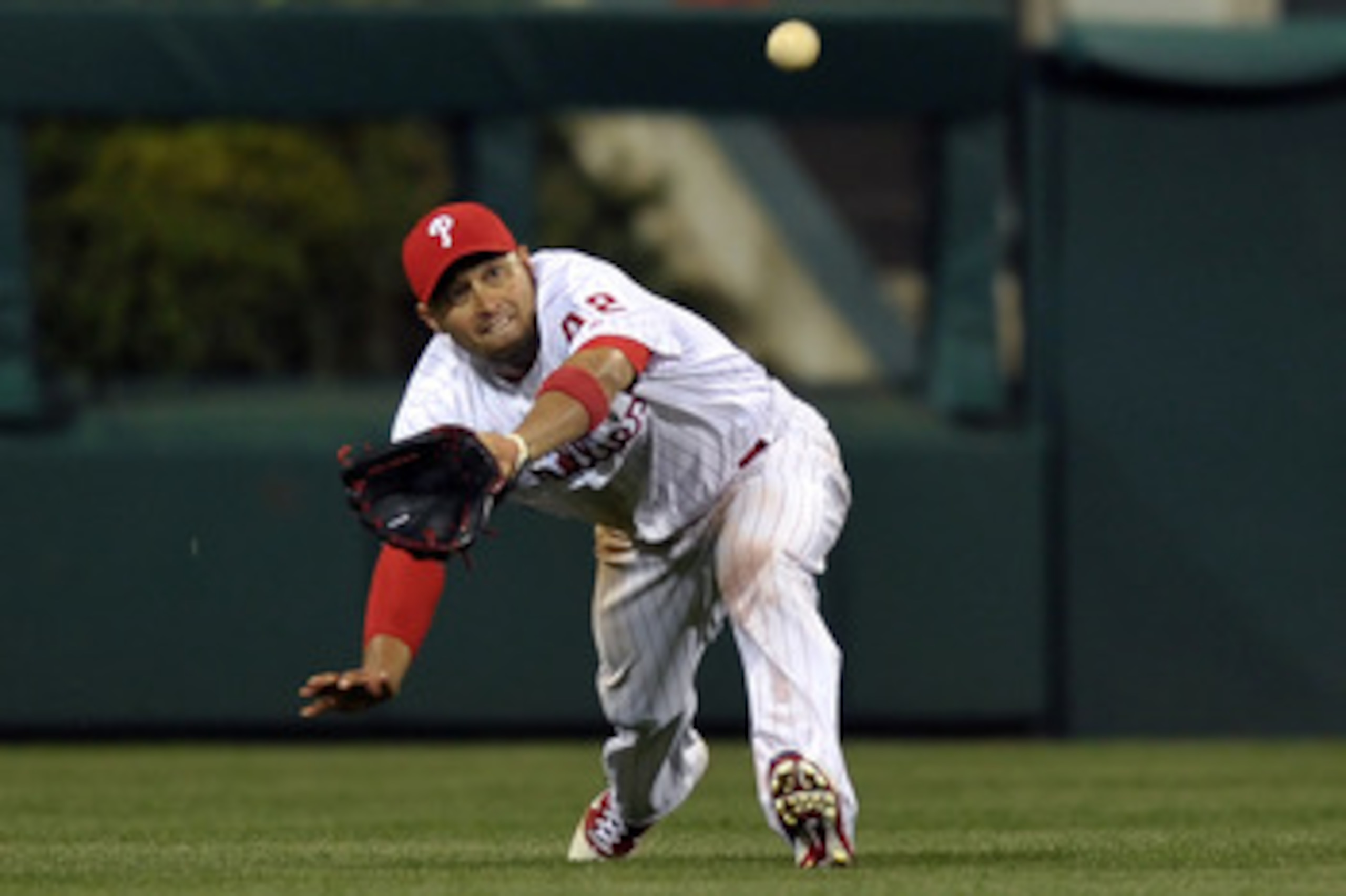 PHILADELPHIA, PA - APRIL 15: Shane Victorino #8 of the Philadelphia Phillies catches a fly ball during the game against the Florida Marlins at Citizens Bank Park on April 15, 2011 in Philadelphia, Pennsylvania. The Marlins won 4-3. (Photo by Drew Hallowel
