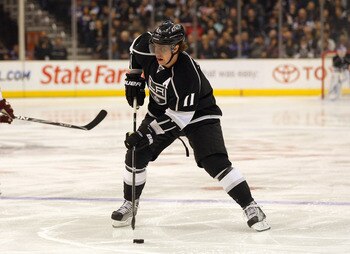 LOS ANGELES, CA - MARCH 03:  Anze Kopitar #11 of the Los Angeles Kings skates the puck into the Phoenix Coyotes zone in the second period during the NHL game at Staples Center on March 3, 2011 in Los Angeles, California. The Kings defeated the Coyotes 1-0