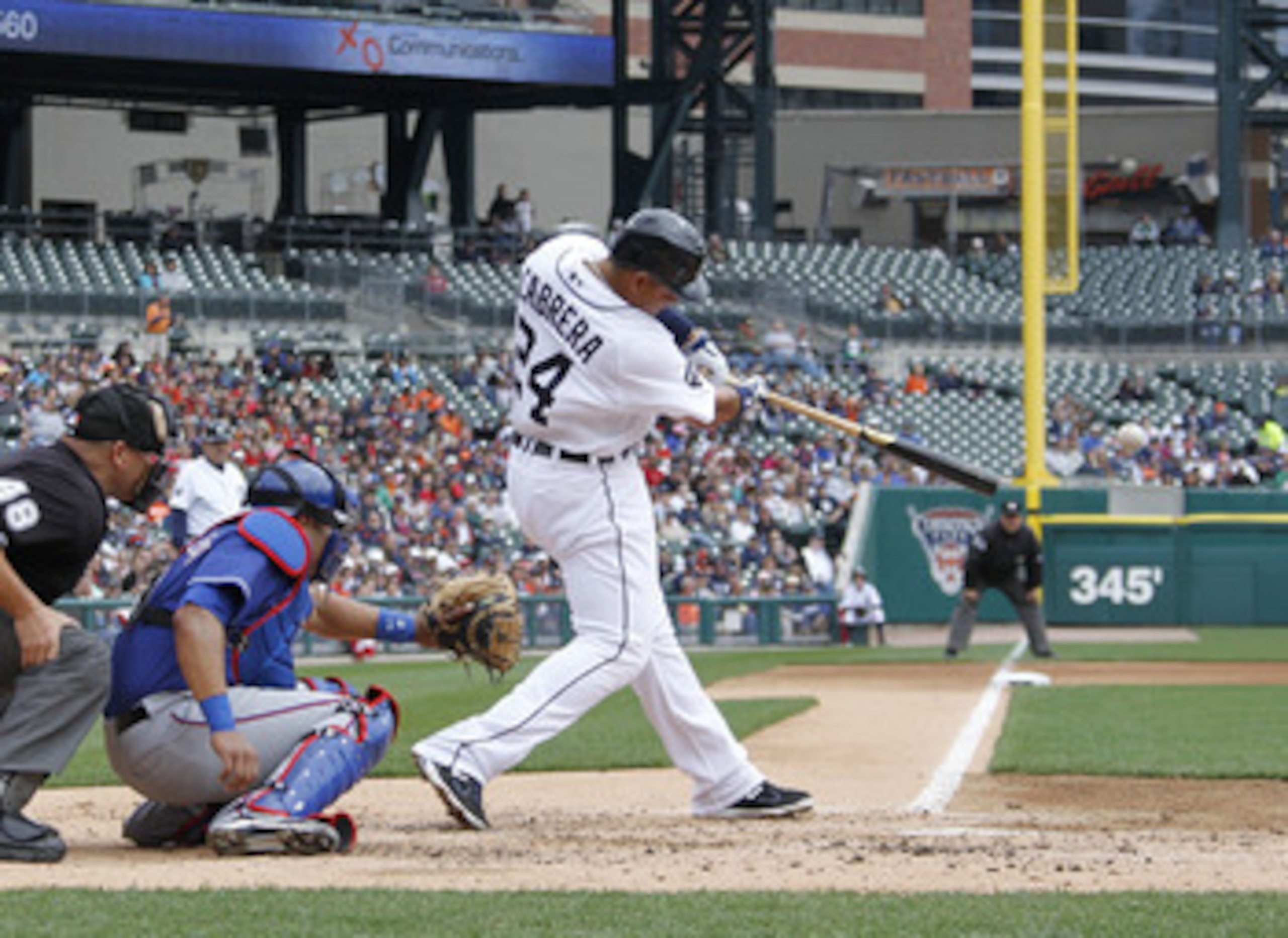 DETROIT, MI - APRIL 11: Miguel Cabrera #24 of the Detroit Tigers hits his 300th career double in the fourth inning in front of Yorvit Torrealba #8 of the Texas Rangers at Comerica Park on April 11, 2011 in Detroit, Michigan. Texas won the game 2-0. (Pho DETROIT, MI - APRIL 11: Miguel Cabrera #24 of the Detroit Tigers hits his 300th career double in the fourth inning in front of Yorvit Torrealba #8 of the Texas Rangers at Comerica Park on April 11, 2011 in Detroit, Michigan. Texas won the game 2-0. (Pho