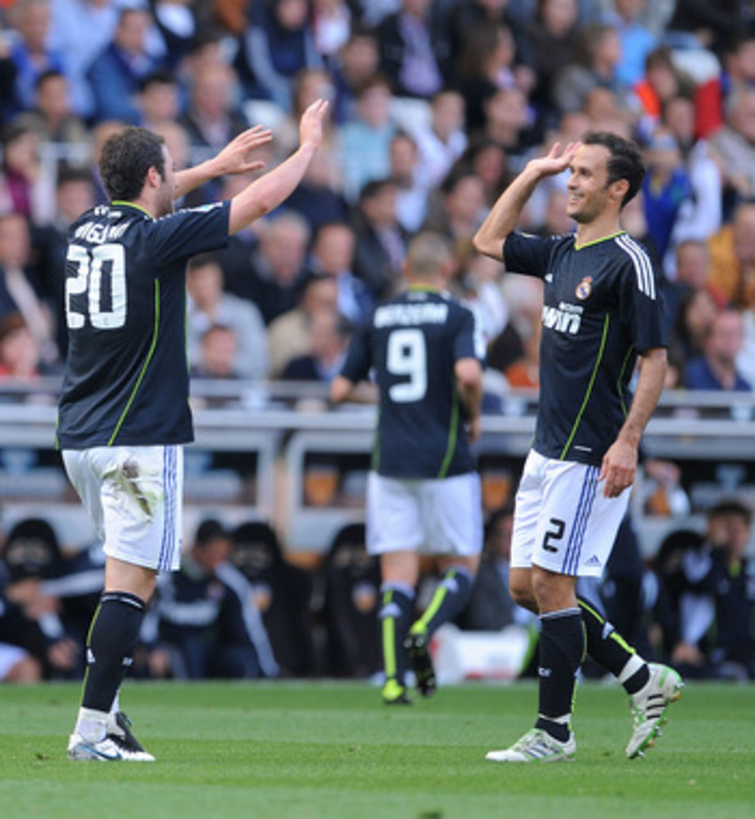 VALENCIA, SPAIN - APRIL 23:  Gonzalo Higuain (L) of Real Madrid celebrates with Ricardo Carvalho after scoring his second goal against Valencia during the La Liga match between Valencia and Real Madrid at Estadio Mestalla on April 23, 2011 in Valencia, Sp