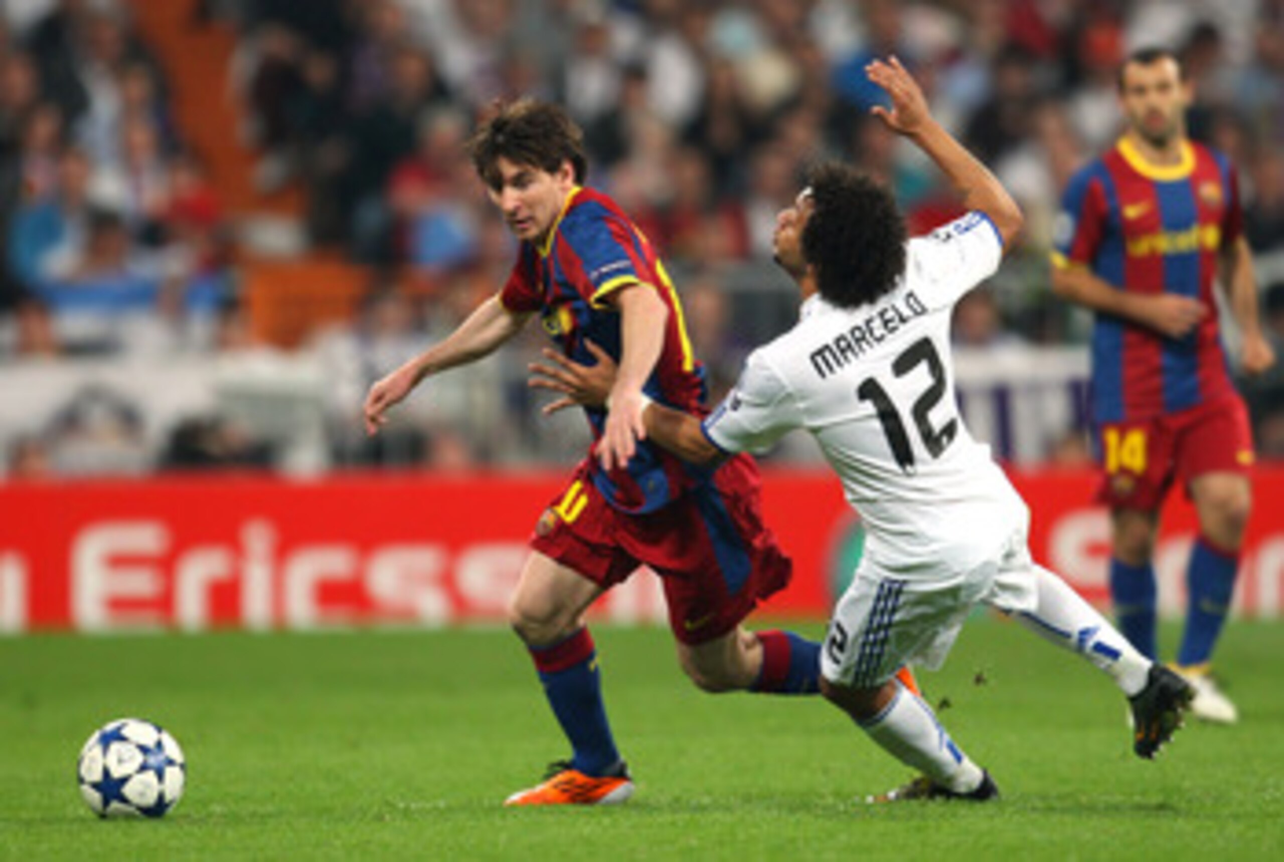 MADRID, SPAIN - APRIL 27:  Lionel Messi of Barcelona beats Marcelo of Real Madrid during the UEFA Champions League Semi Final first leg match between Real Madrid and Barcelona at Estadio Santiago Bernabeu on April 27, 2011 in Madrid, Spain.  (Photo by Ale
