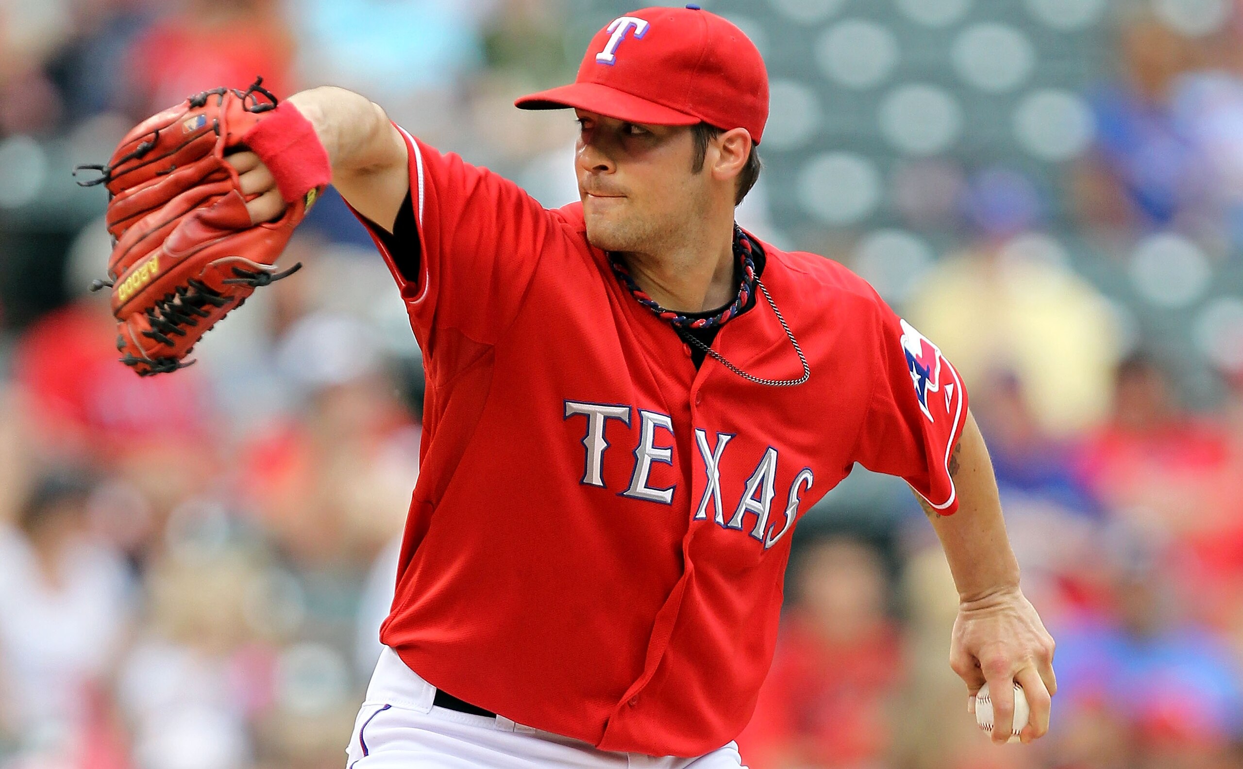 ARLINGTON, TX - APRIL 24:  Pitcher C.J. Wilson #36 of the Texas Rangers throws against the Kansas City Royals at Rangers Ballpark in Arlington on April 24, 2011 in Arlington, Texas.  (Photo by Ronald Martinez/Getty Images)