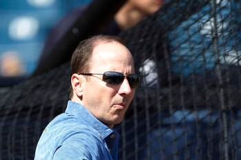 TAMPA, FL - FEBRUARY 21:  Brian Cashman Senior Vice President and General Manager of the New York Yankees watches the action during the first full team workout of Spring Training on February 20, 2011 at the George M. Steinbrenner Field in Tampa, Florida.