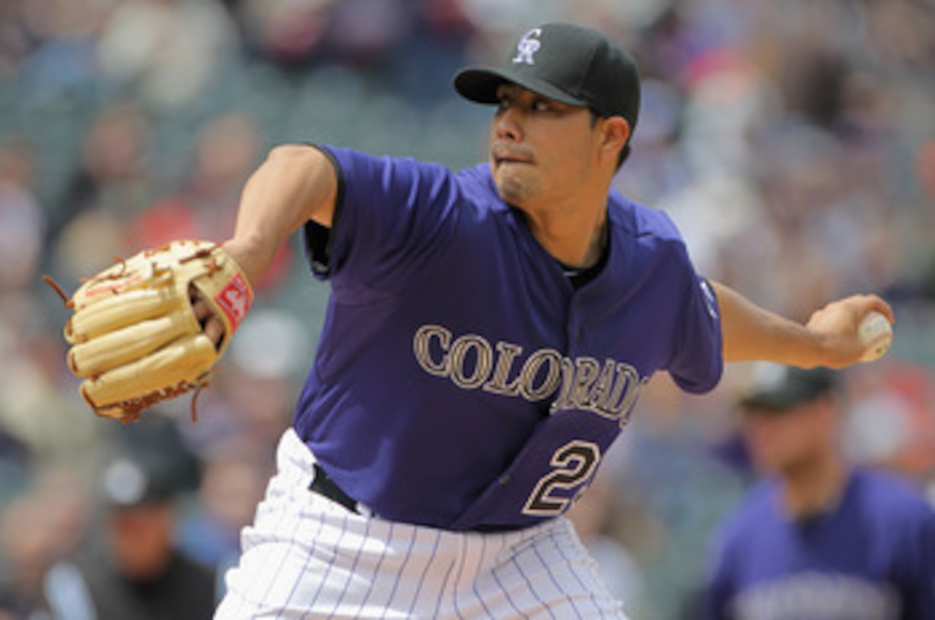 DENVER, CO - APRIL 20:  Starting pitcher Jorge De La Rosa #29 of the Colorado Rockies delivers against the San Francisco Giants at Coors Field on April 20, 2011 in Denver, Colorado.  (Photo by Doug Pensinger/Getty Images)